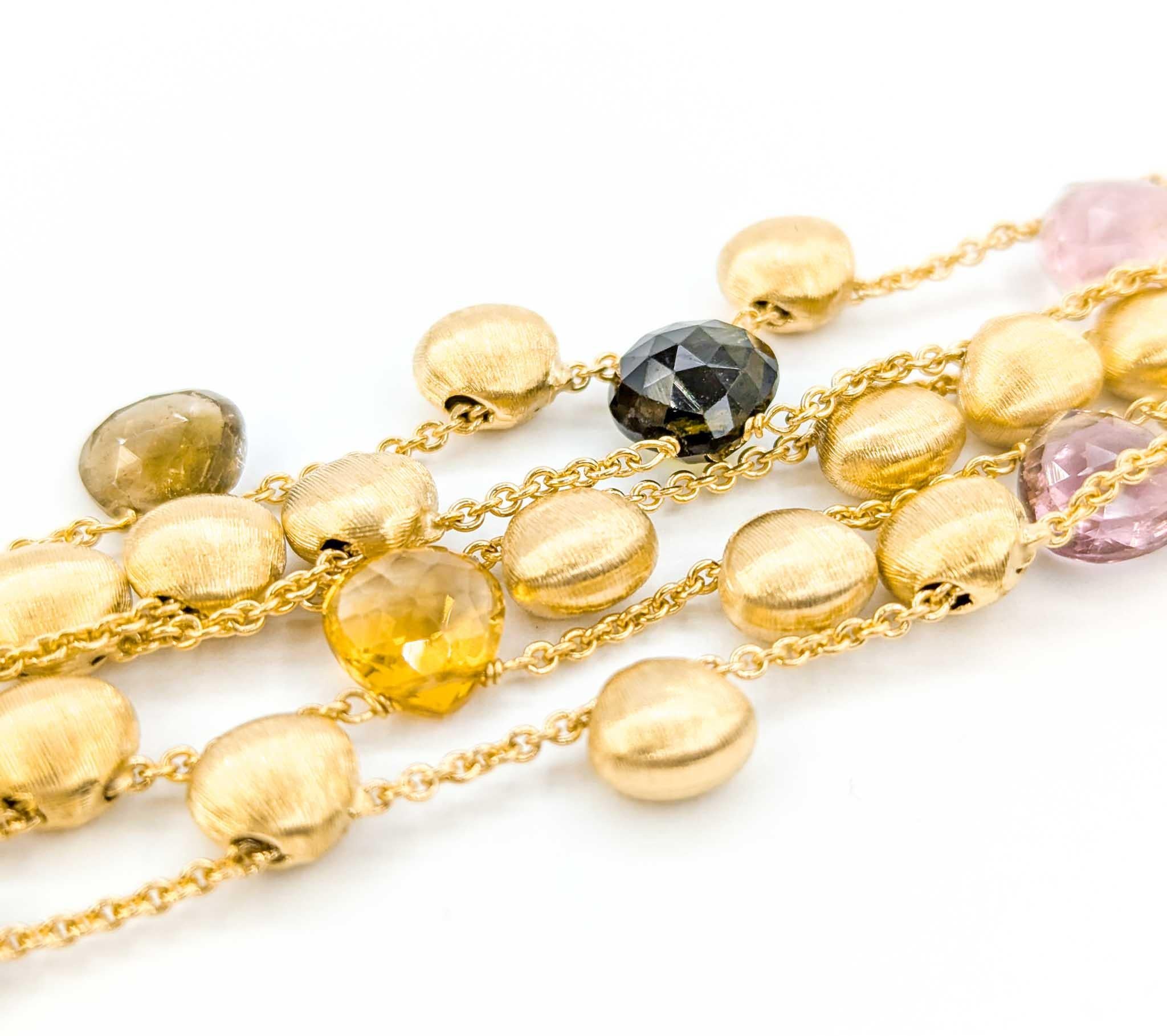 Marco Bicego Paradise 5 Row Gemstone Bracelet en or jaune 18k

Voici ce magnifique bracelet Marco Bicego, réalisé avec expertise en or jaune 18 carats. Ce magnifique bracelet est composé d'un ensemble de pierres précieuses en quartz, tourmaline et