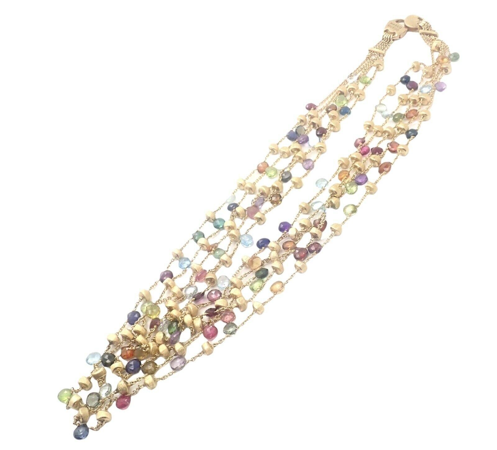 18k Yellow Gold Paradise Multicolor Gemstone 5 Strand 16 Inch Long Necklace by Marco Bicego.
With Mixed semi-precious colored stones
Necklace includes round briolette cut blue topaz, pink and green tourmaline, garnet, peridot and clear quartz