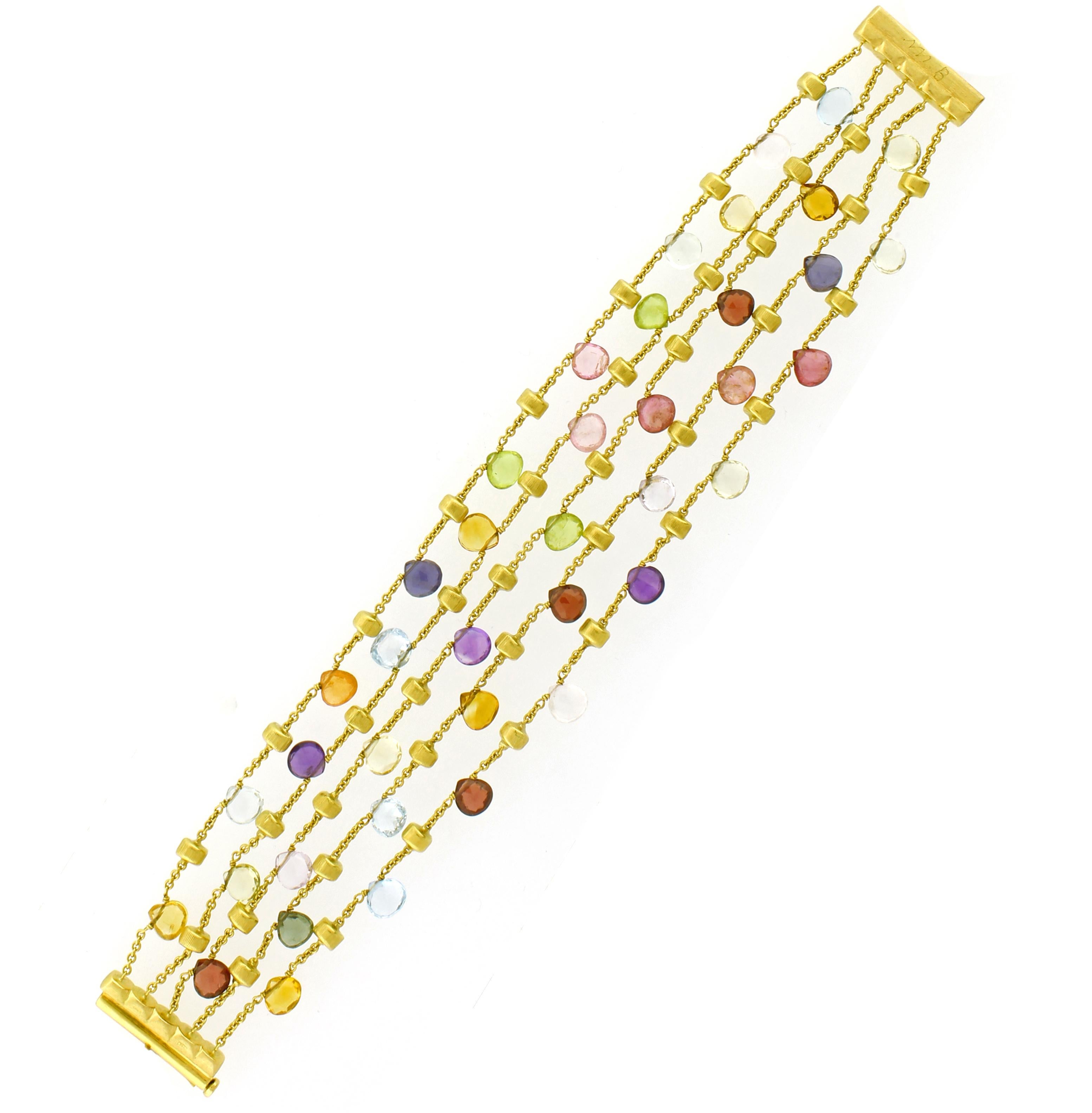 From Marco Bicego  paradise collection his  18 karat yellow gold five strand bracelet with tabeez cut multi-colored semi-precious gemstones. A timeless and playful Marco Bicego classic, this Paradise Multicolor Gemstone Bracelet is hand engraved by