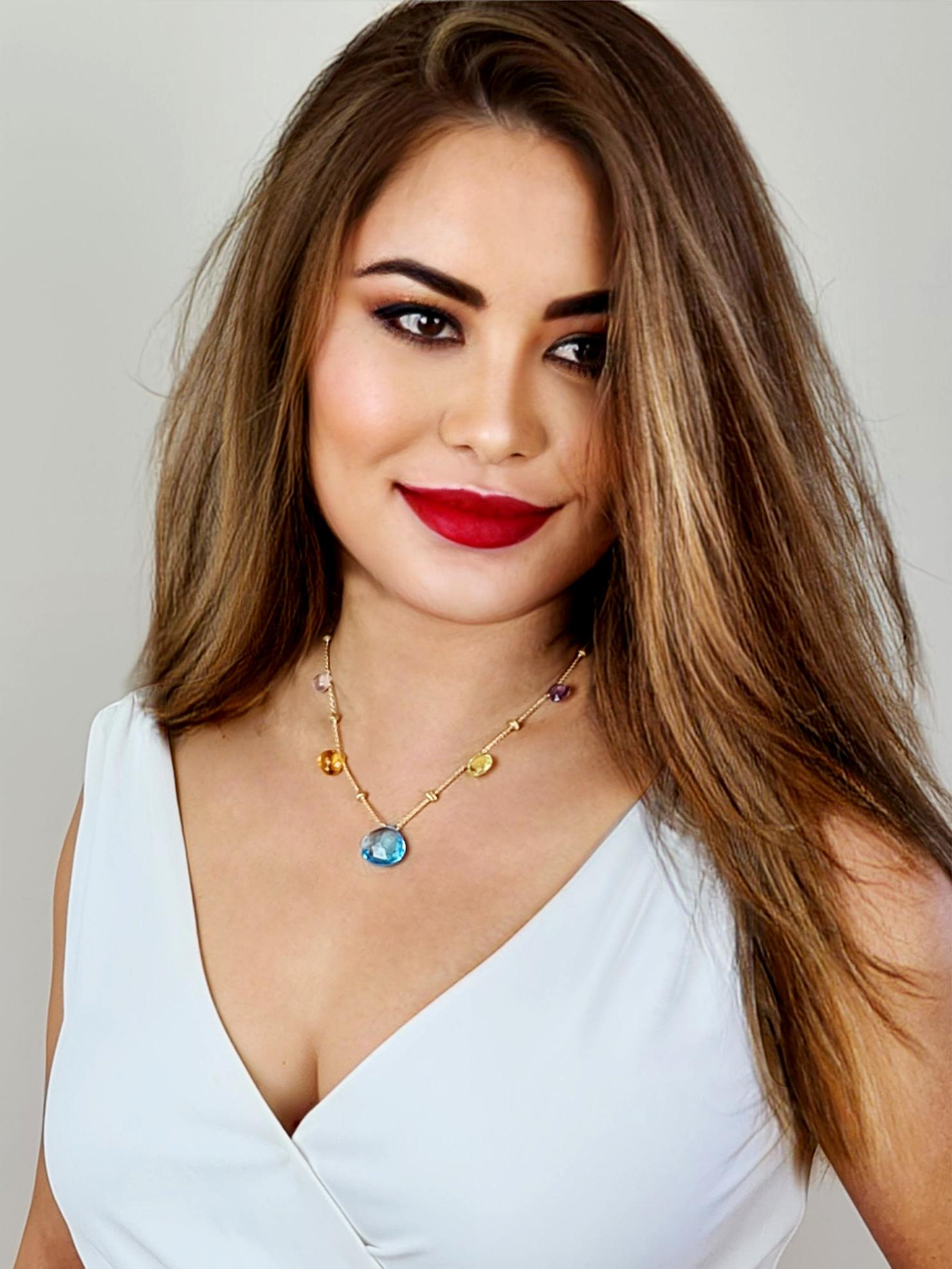 18K yellow gold short graduated necklace with tabeez cut multi-colored semi-precious gemstones set in 18 carat yellow gold. A timeless and playful Marco Bicego classic, this Paradise Multicolor Gemstone Necklace is hand engraved by Italian artisans
