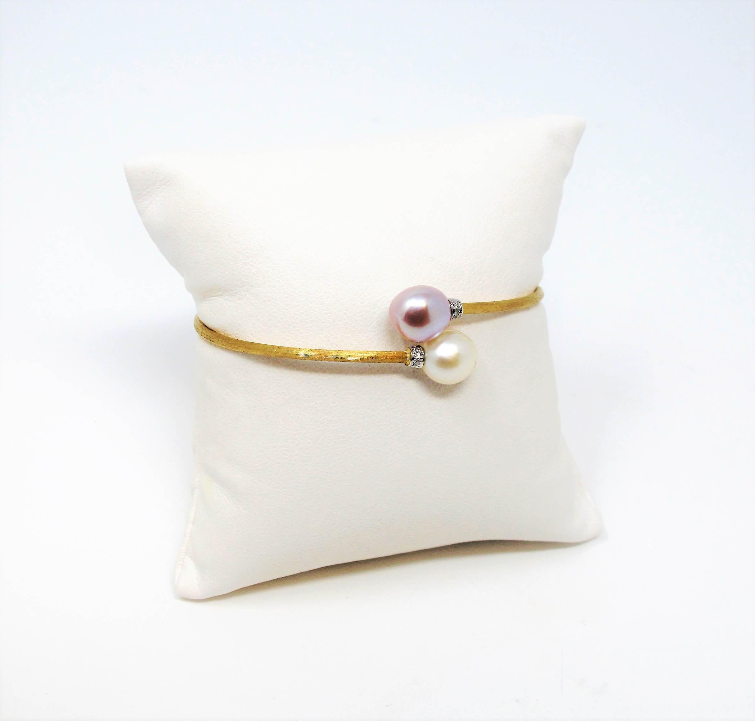 Gorgeous, ultra feminine diamond and cultured pearl bracelet by Italian jewelry designer, Marco Bicego. With its ultra thin band, soft pink and white pearls, and just a touch of diamond sparkle, this bracelet is the perfect choice for an understated