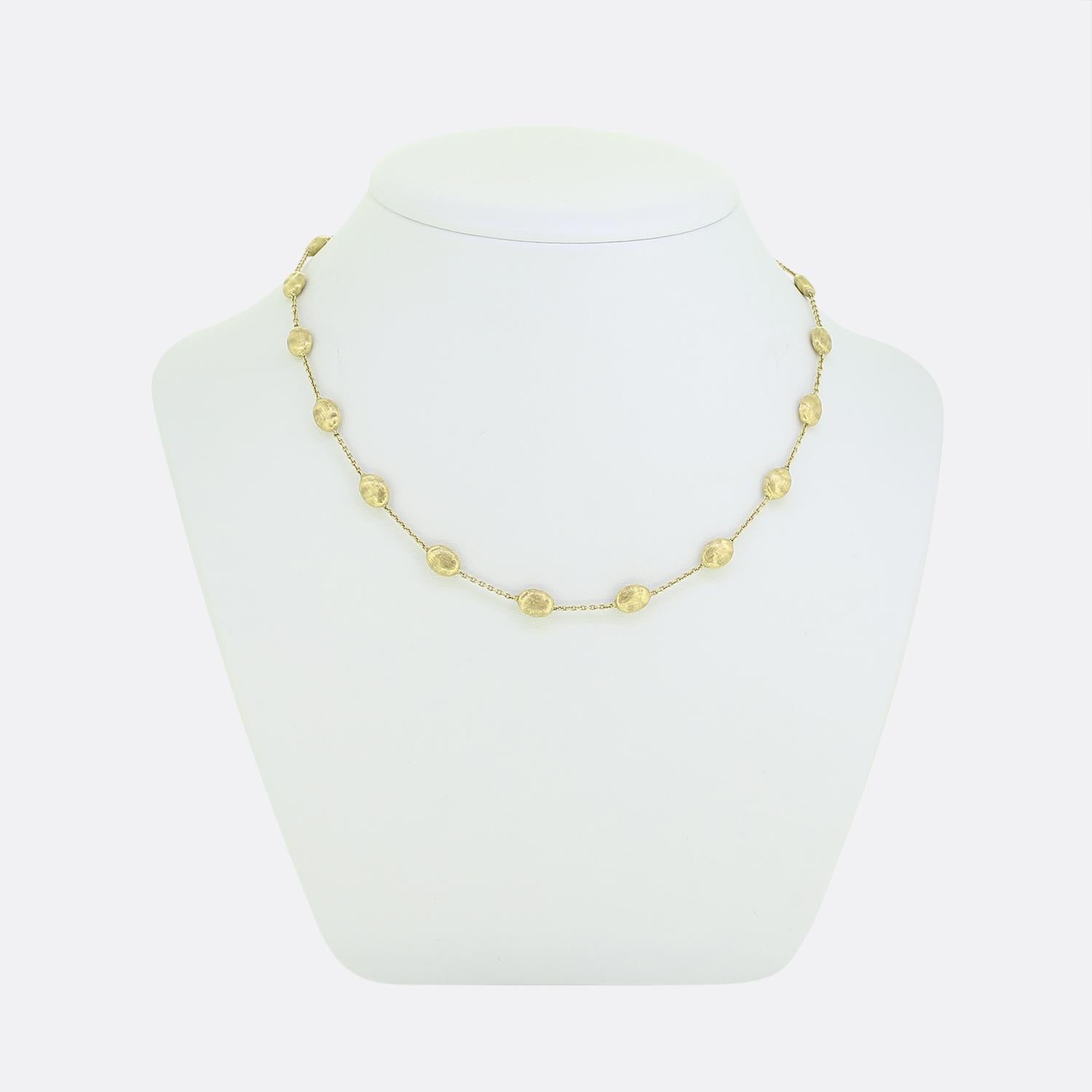 This necklace forms part of a Marco Bicego Siviglia collection inspired by the beautiful and exotic cobblestone streets of Seville in Spain. This necklace features hand engraved pebble shaped accents engraved with the distinctive bulino technique