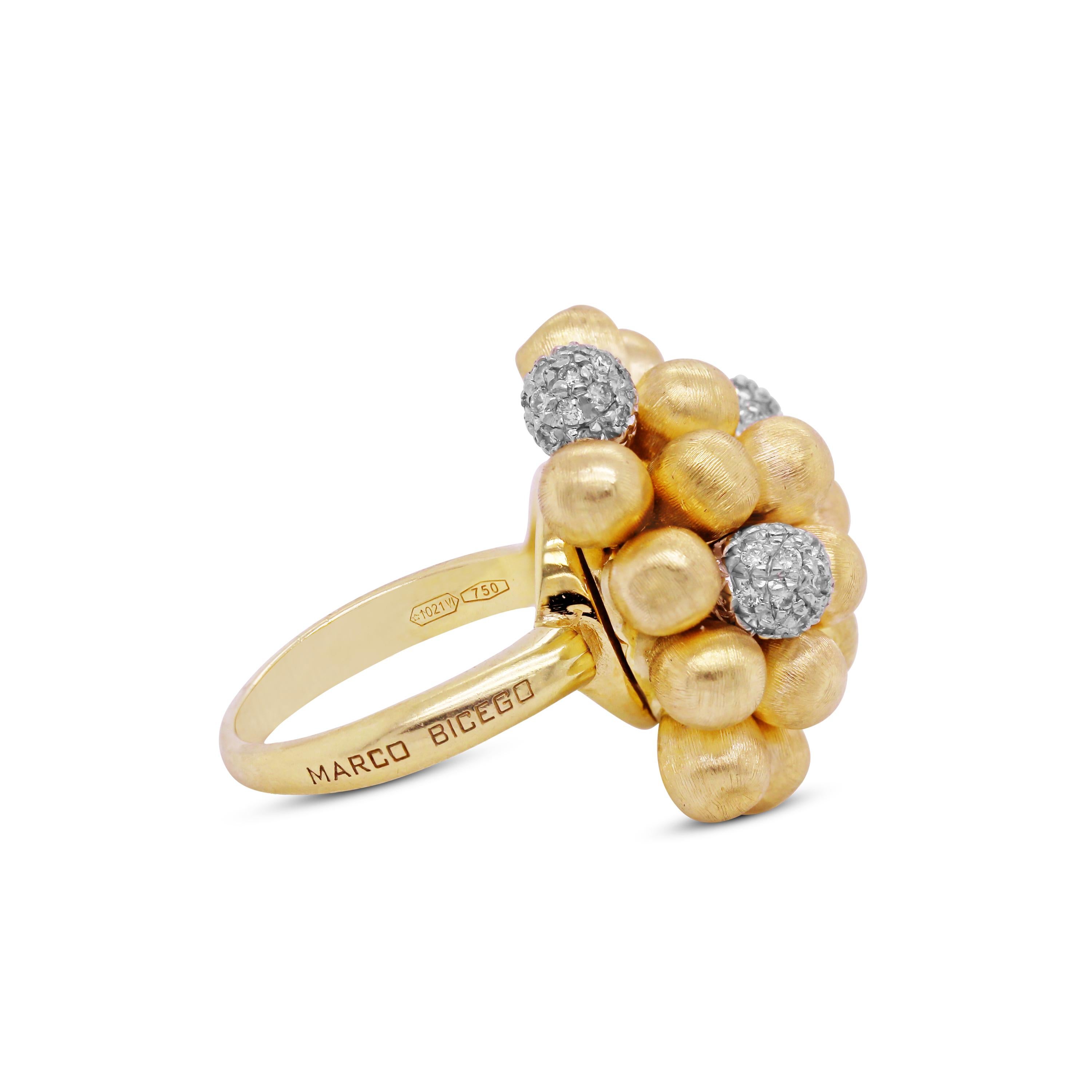 18K Yellow and White Gold Ring with Diamonds by Marco Bicego

This ring features round balls in the center. The yellow is brushed, matte finished while the white gold features diamonds

Apprx. 0.80 carat G color, VS clarity diamonds total