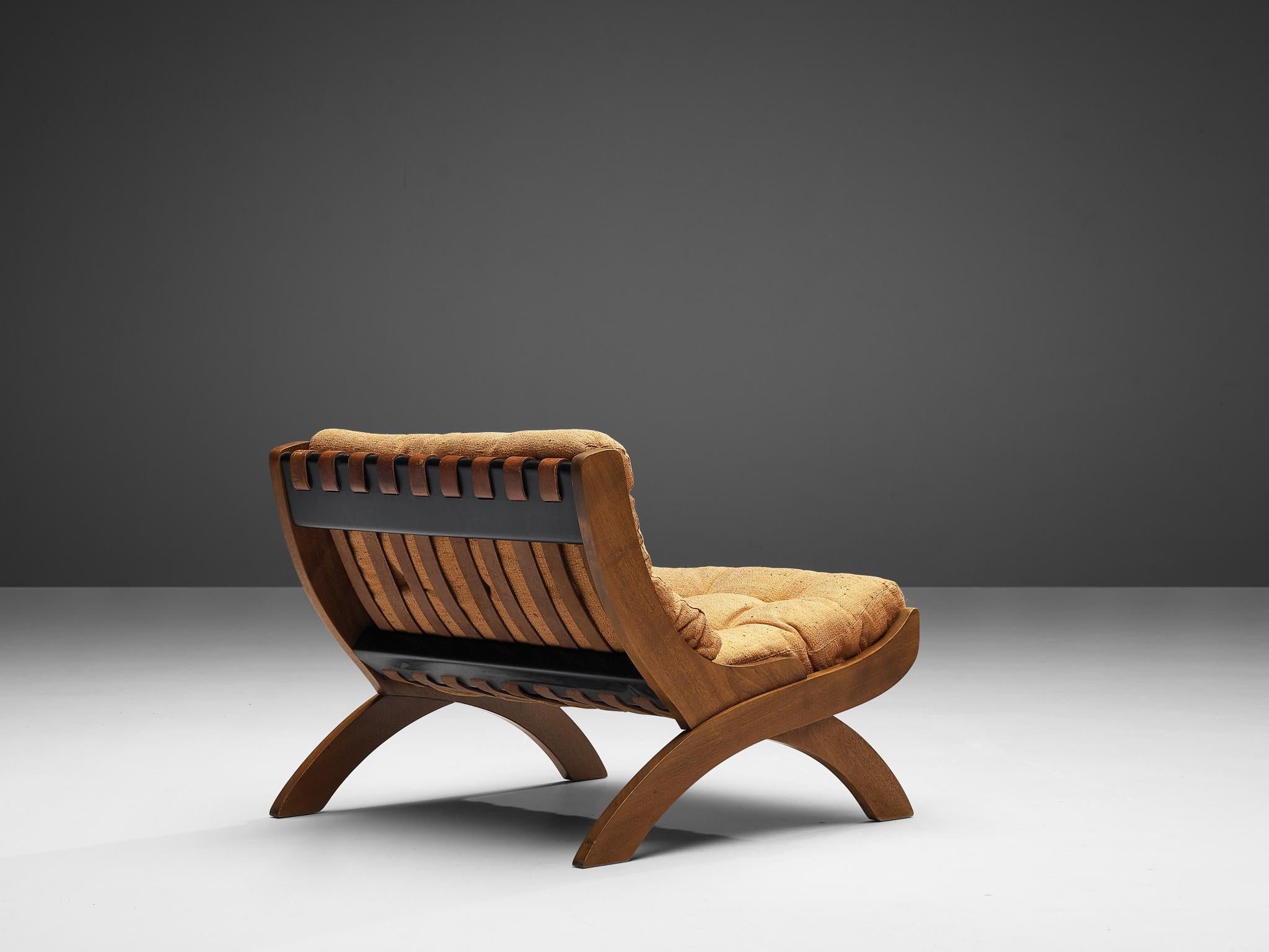 Marco Comolli for ICF, lounge chair, model ‘CP1’, walnut, light orange fabric, leather, Italy, 1965

This lounge chair by Marco Comolli presents an exquisite fusion of materials. The cognac leather straps composing the back are responsible for