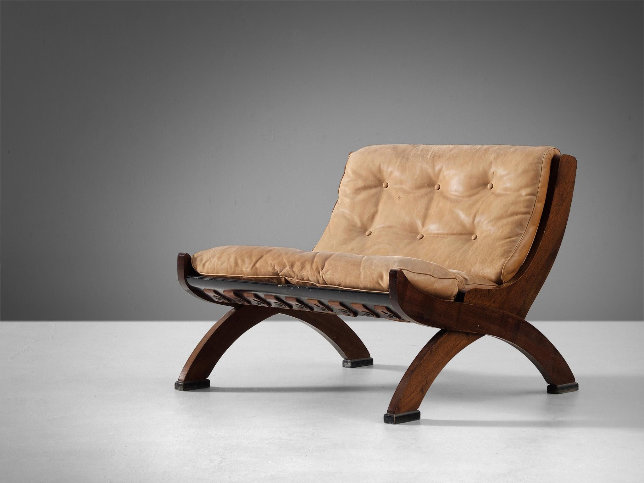 Marco Comolli for I.C.F. De Padova, lounge chair model 'CP1', leather, walnut, italy, 1960s 

This well-constructed slipper chair embodies a splendid structure based on a simplistic, natural and timeless aesthetics. The walnut frame is beautifully