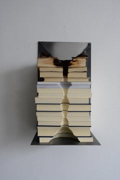 Per un soffio, minimalist wall sculpture with sculpted books by Marco Cordero