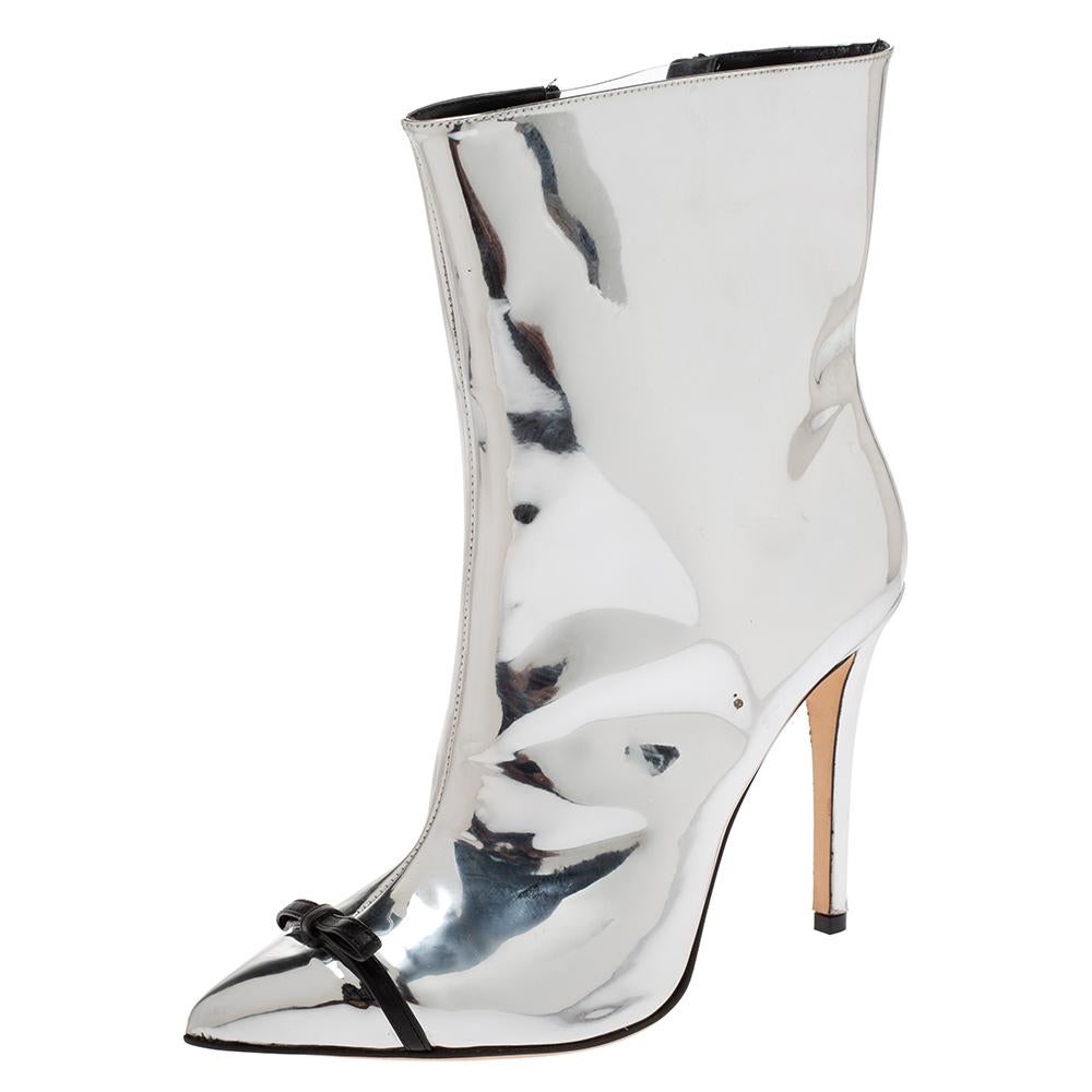 Let these ankle boots from Marco de Vincenzo help you shine a little more than others and amaze onlookers with every step! They have been crafted from metallic silver leather and styled with pointed toes and zippers on the sides. They feature