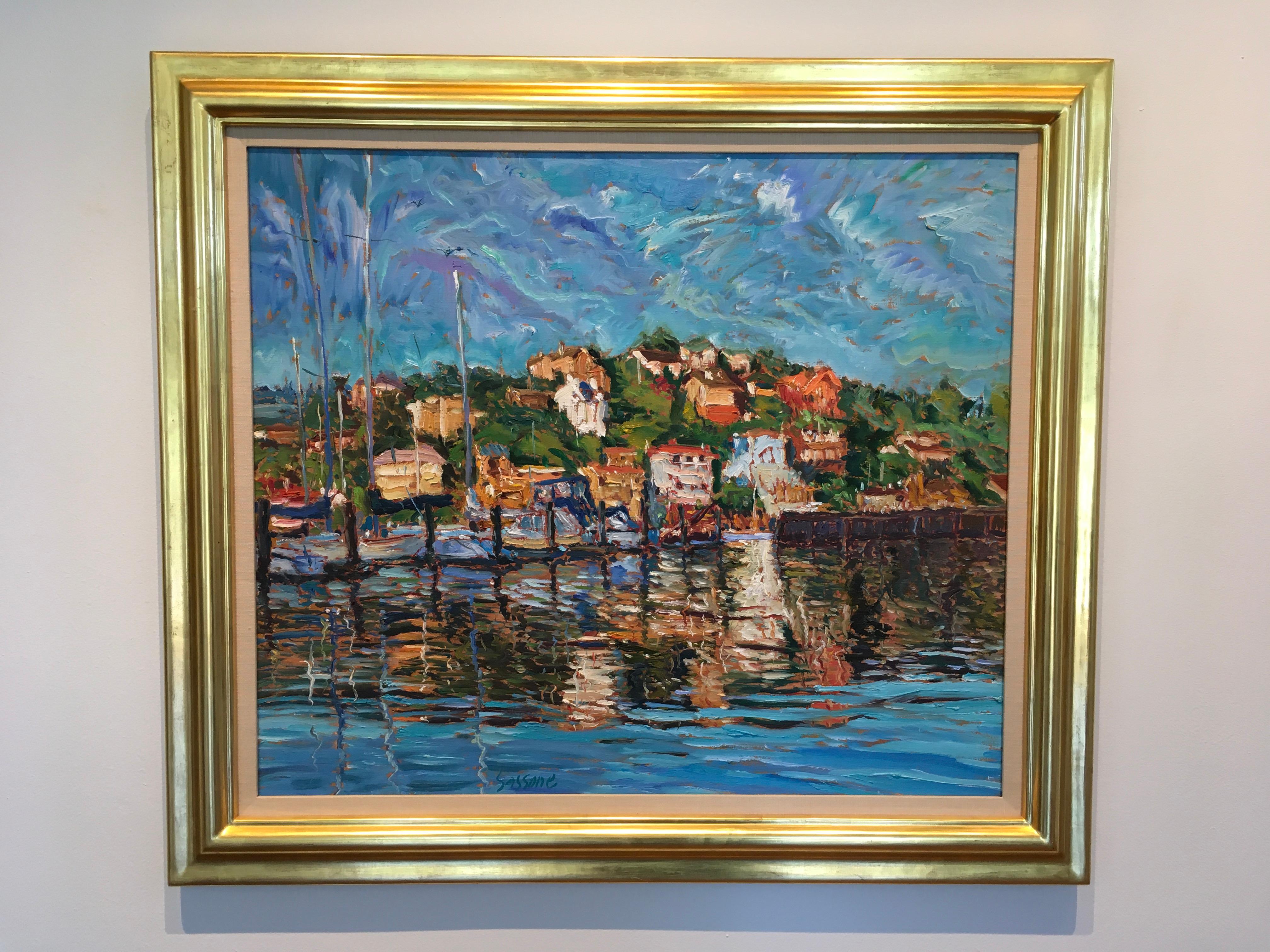 This framed oil on linen painting, 'Riflessi A Tiburon,' by Marco Sassone, an American-Italian painter, is measured at 30 x 24 inches in a horizontal format. Sassone paints an Expressionist view of a coastal, village scene. The striking blue water