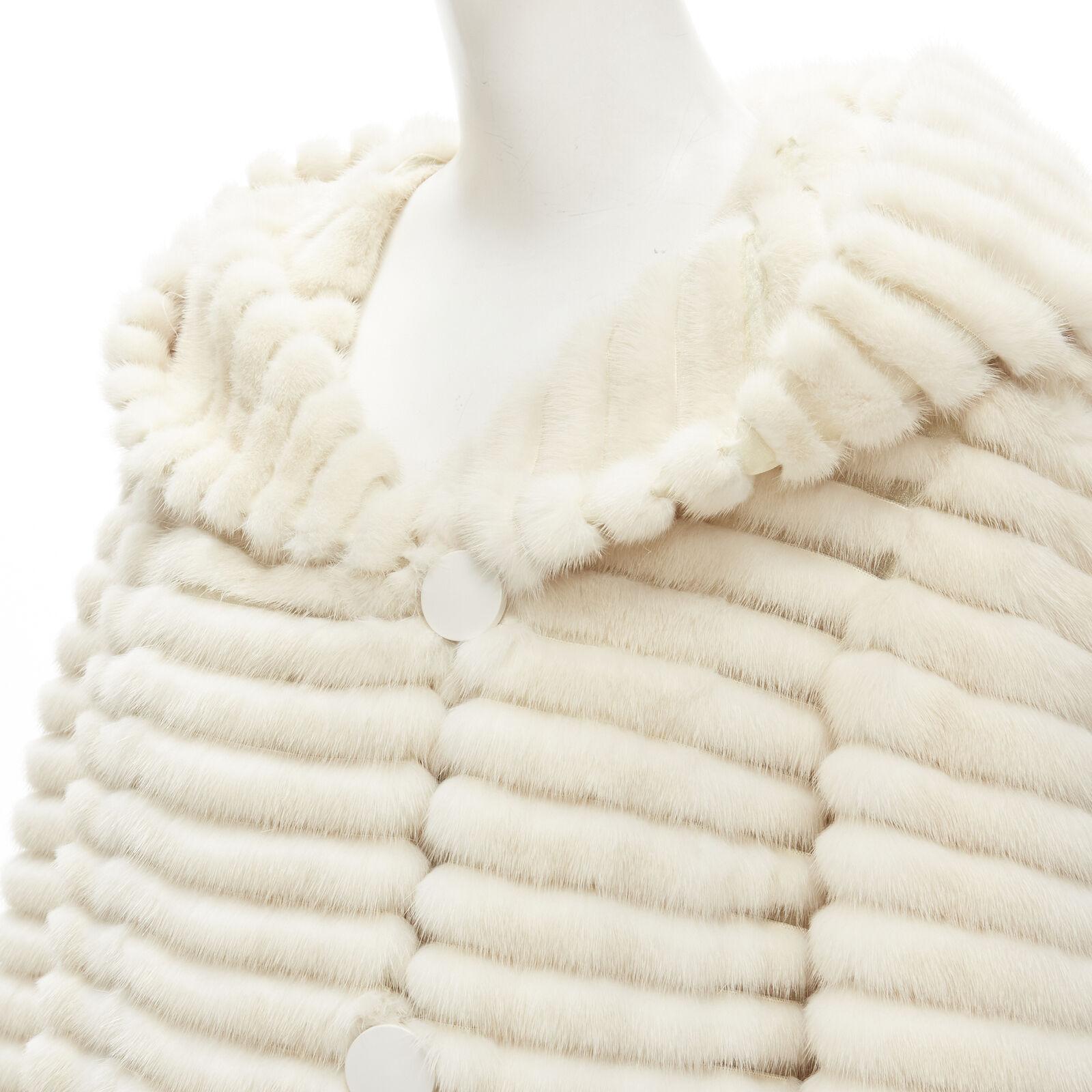 MARCO VANOLI cream tulle fur stripes buttoned asymmetric hooded jacket IT40 S
Reference: KNLM/A00067
Brand: Marco Vanoli
Material: Fur, Tulle
Color: Ecru
Pattern: Striped
Closure: Button
Lining: Silk
Made in: Italy

CONDITION:
Condition: Excellent,