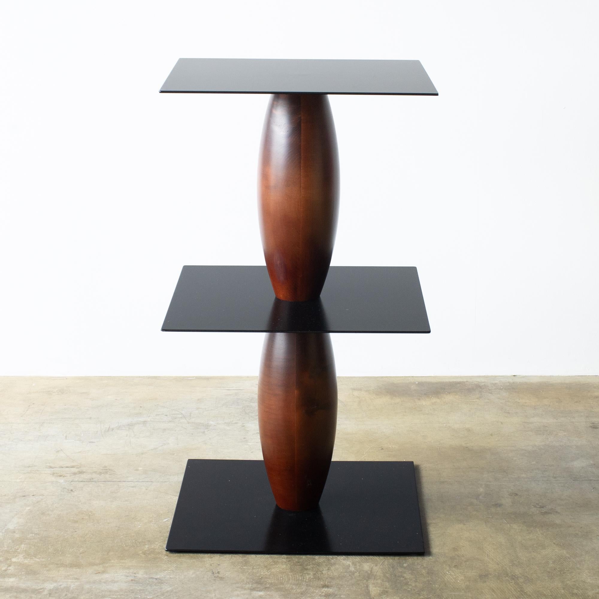 Zanzibar side table designed by Marco Zanini for Bieffeplast. Marco Zanini designed 12 side tables for Bieffeplast around the late 80s. This is one of 12 varietions that Bieffeplast released in those days. 

Plates are made of painted steel. Pole is