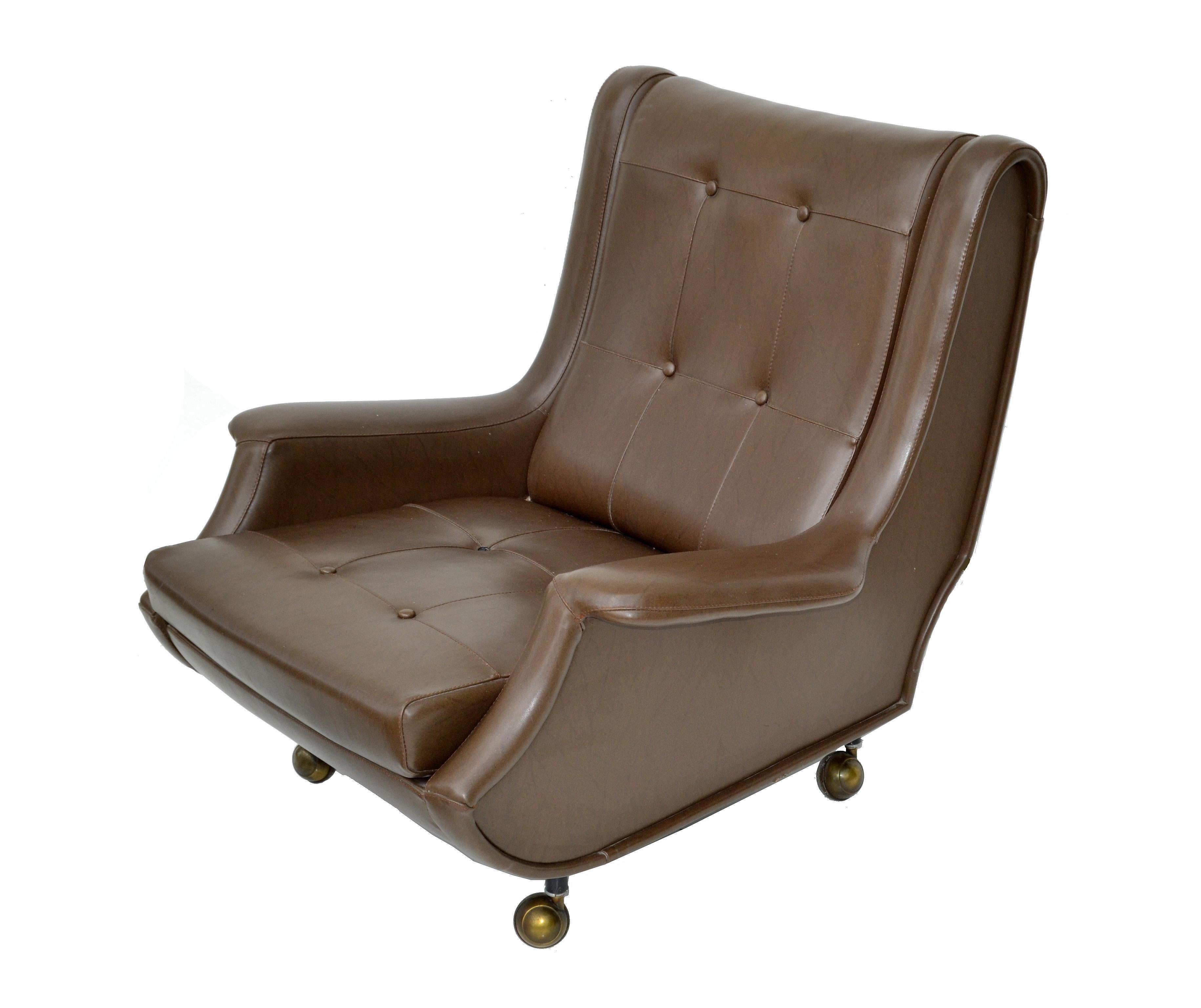 Exceptional chair  designed by Marco Zanuso made by Arflex, Italy. 
Original brown leather, chair  on casters.
Measures: Chair 33.25 H, 33 W, 33 D,15.5 seat height, 21 W seat interior, Arm Height: 18.25 inches. 
Ottoman: 22 inches x 22 inches x 14.5