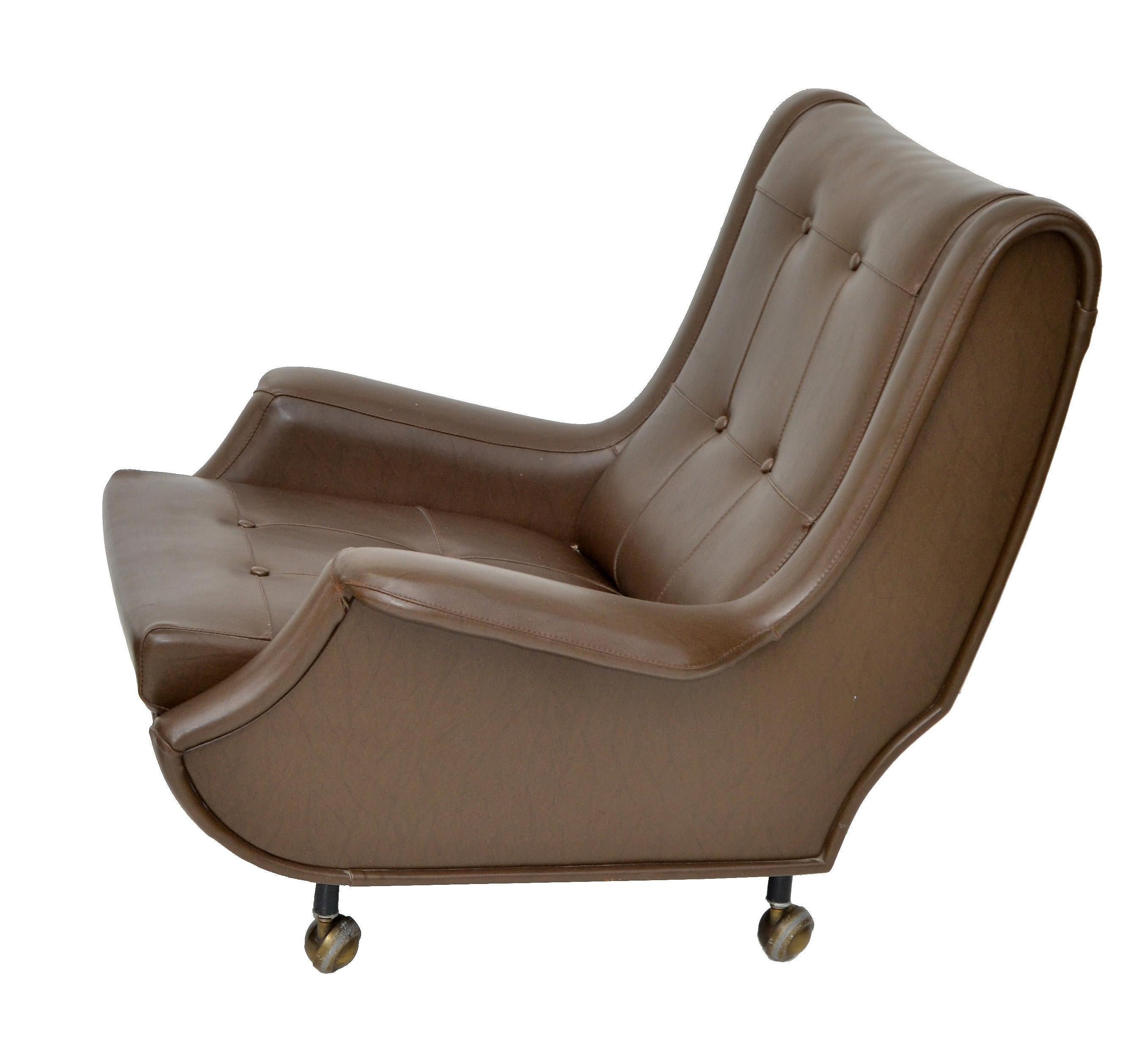 Exceptional Lounge chair designed by Marco Zanuso made by Arflex, Italy. 
Original brown leather Armchair on Brass casters.
Measures: Chair 33.25 H, 33 W, 27 D, 15.5 seat height, 21 W seat interior, Arm Height: 18.25 inches. 
In all original
