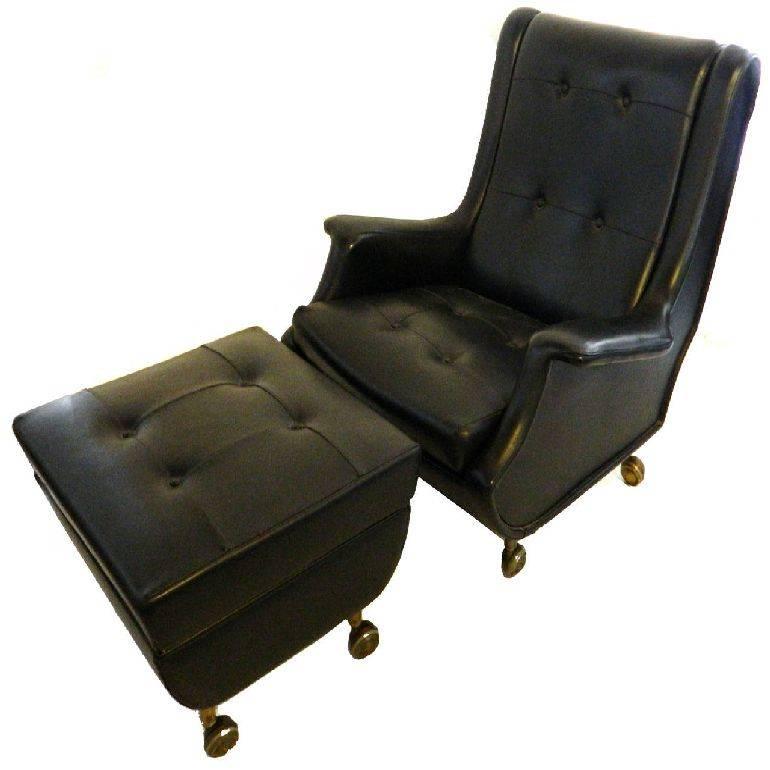 Exceptional chair and ottoman designed by Marco Zanuso made by Arflex, Italy. 
Original black leather, chair and ottoman on casters.
Measures: Chair 33 H, 31 W, 33 D overall, 27 D seat, 16 H seat, 21 W seat, 24 H back seat. 
Ottoman: 22 inches x 22