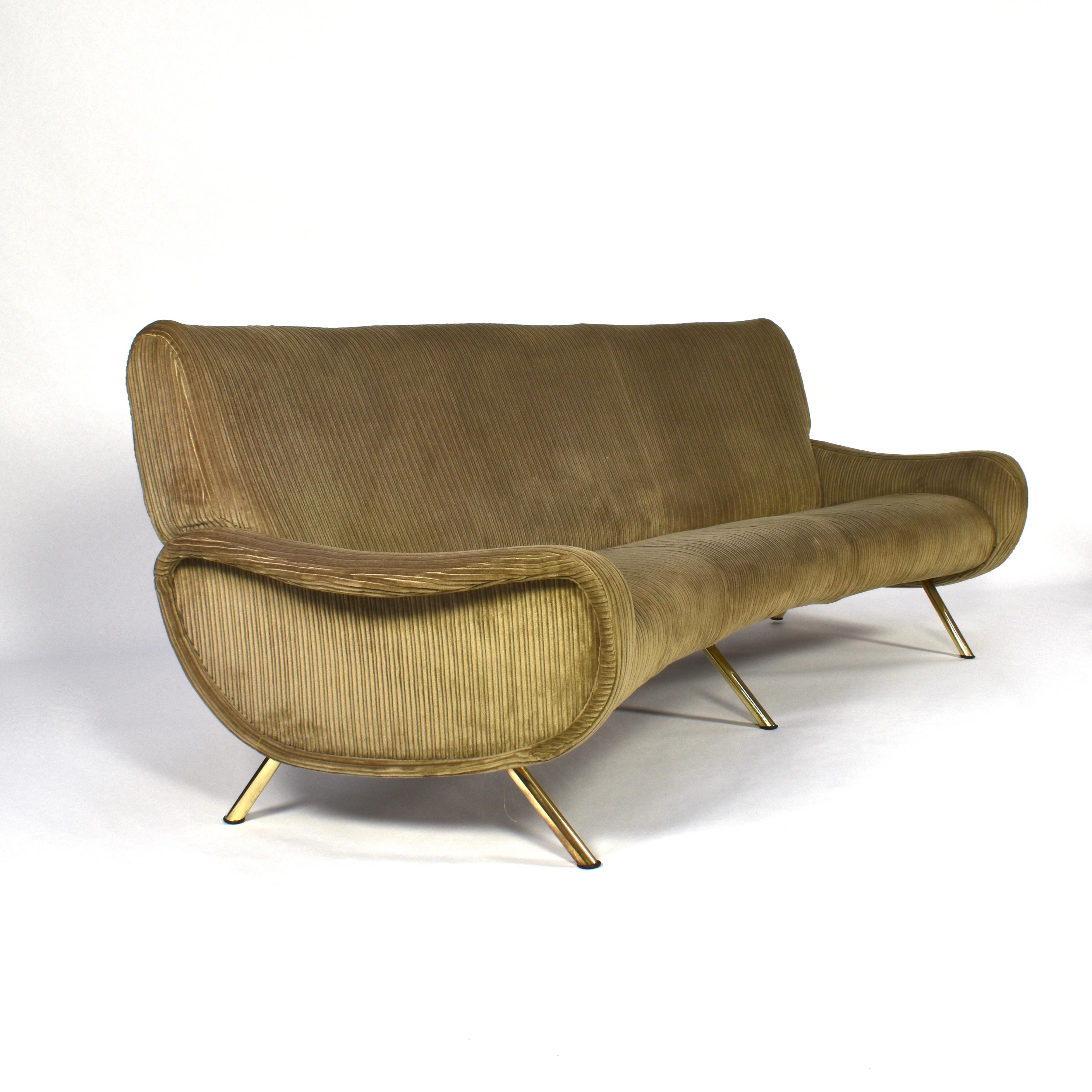 Rare and exclusive curved sofa by Marco Zanuso for Arflex, Italy, 1951. The sofa still has its original green rib corduroy velvet fabric and features brass legs. The sofa does not need to be reupholstered but is open for customization: the sofa can
