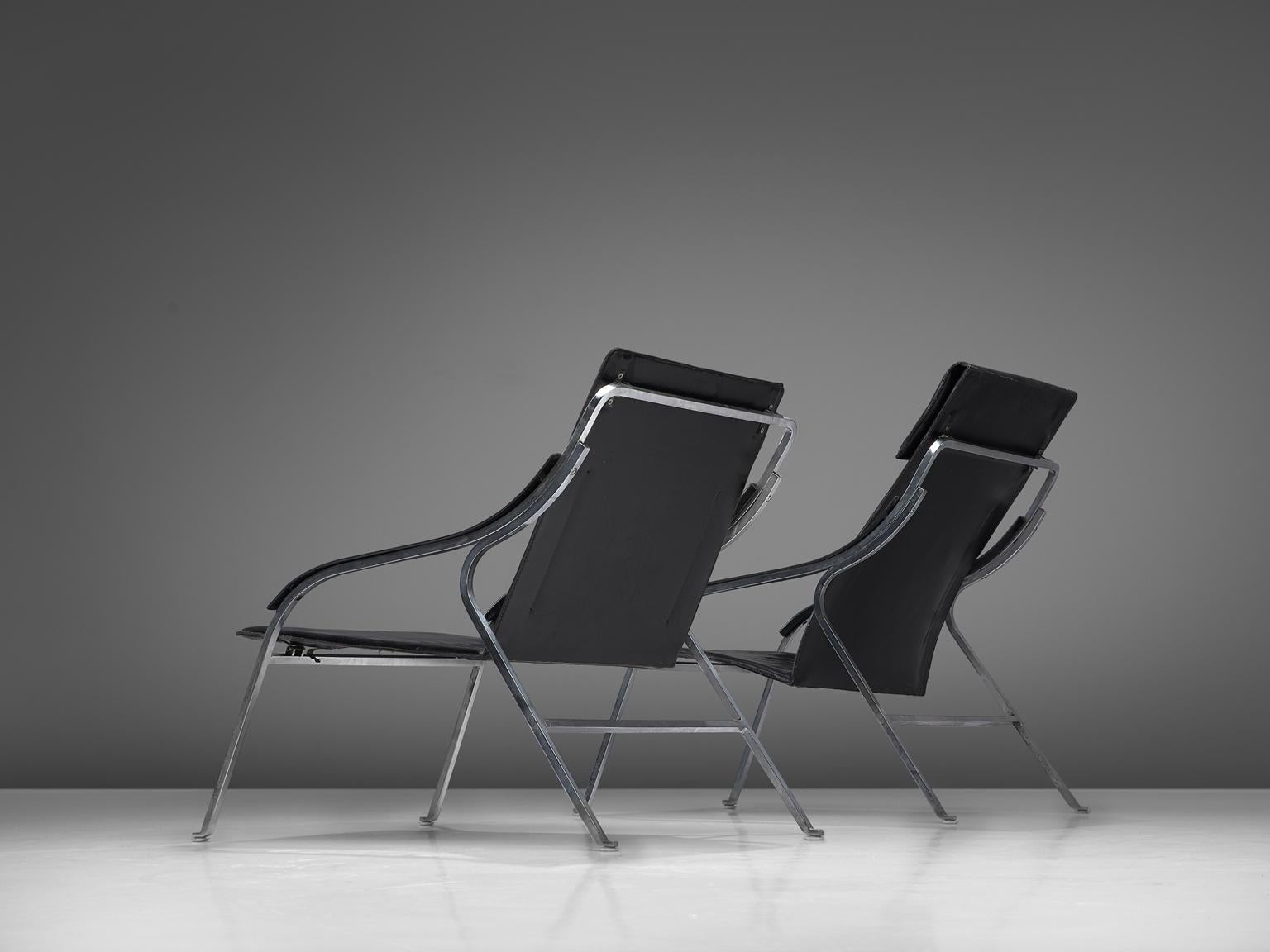 Marco Zanuso for Arflex, fourline lounge chairs, black leather and steel, Italy, 1964.

This set of lounge chairs by Zanuso remains among the best examples of armchairs designed by the architect. It is not only the ingenious slender design that