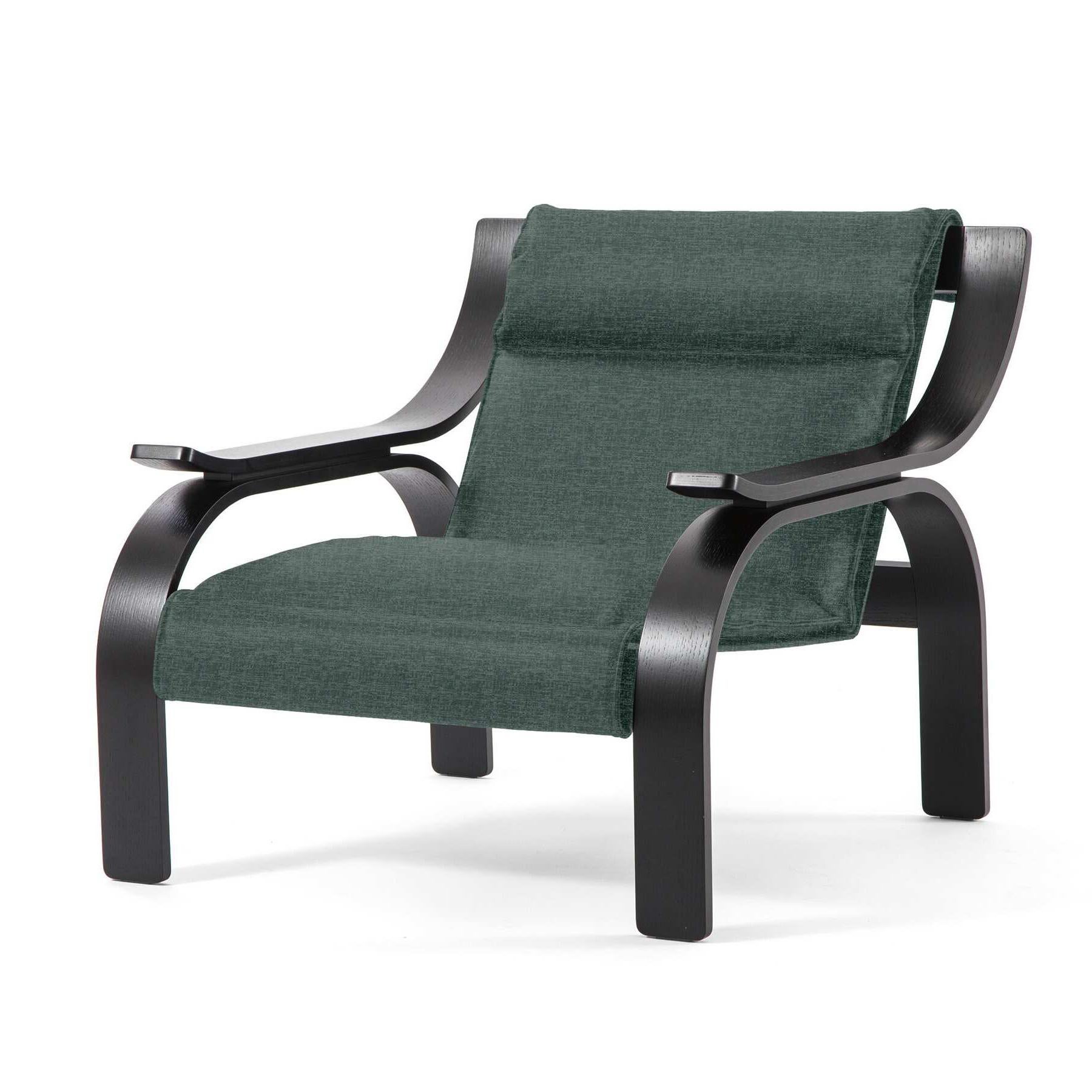 Fauteuil Woodline conçu par Marco Zanuso en 1964, relancé en 2015.

Tissu vert et bois teinté noir.

Fabriqué par Cassina en Italie.

Un fauteuil au design saisissant et rigoureux, fruit des recherches de Marco Zanuso sur l'ancrage d'un siège sur