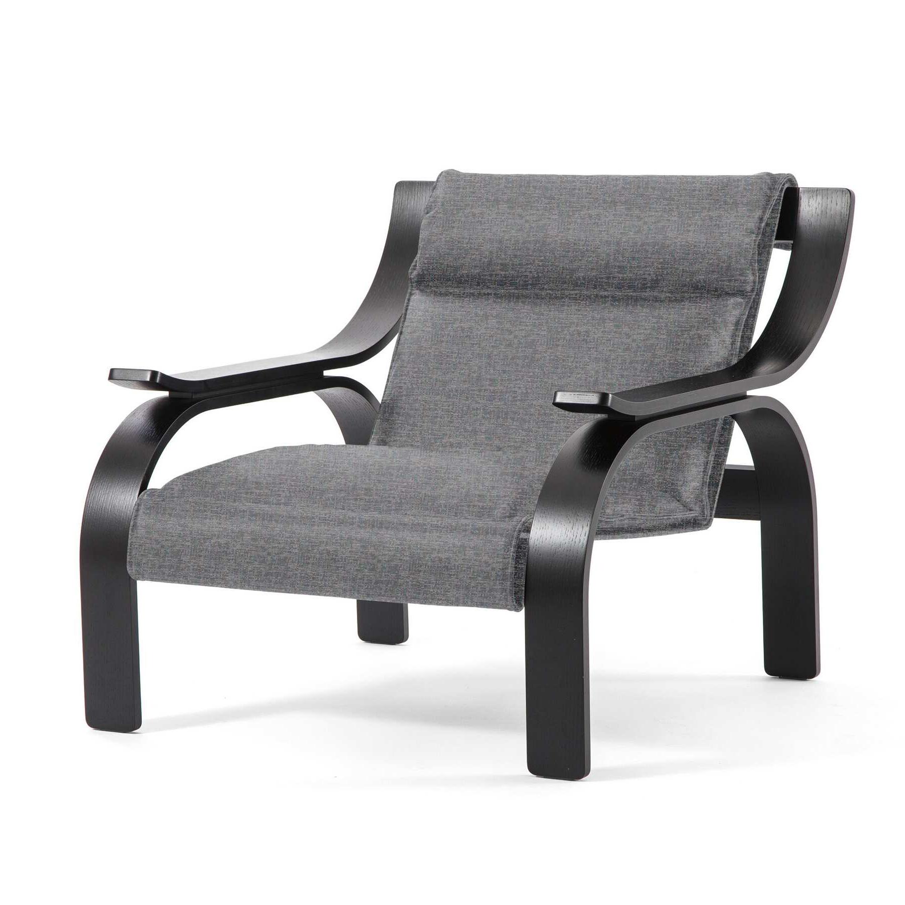 Woodline armchair designed by Marco Zanuso in 1964, relaunched in 2015.

Grey fabric and black stained wood.

Manufactured by Cassina in Italy.

An armchair with a striking, rigorous design, the outcome of research by Marco Zanuso on how to