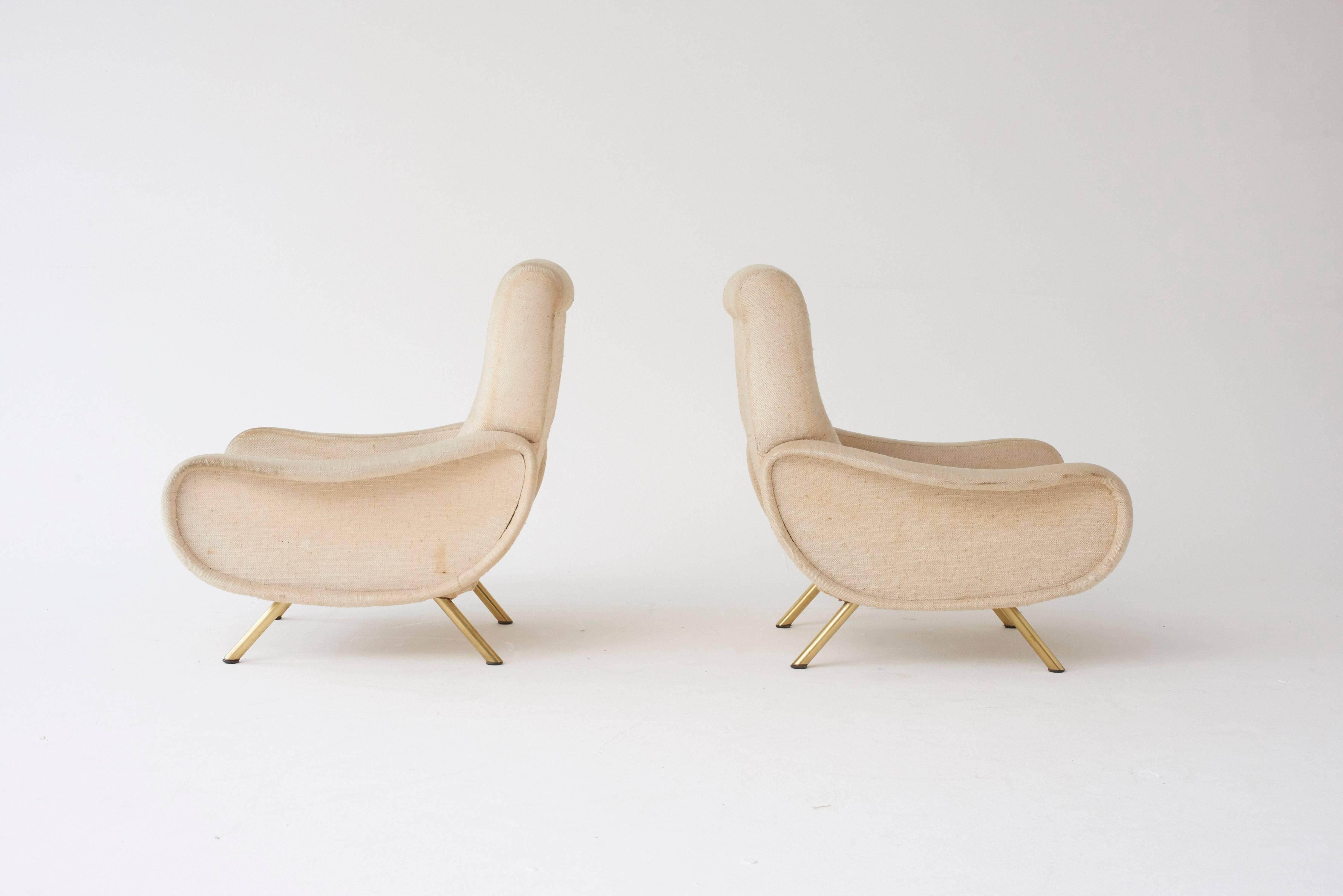 A pair of original Marco Zanuso Lady chairs, Arflex, France/Italy, 1960s. The fabric is a bit dirty so the price here includes recovering in customer supplied material.  Ships worldwide - please contact us for options.