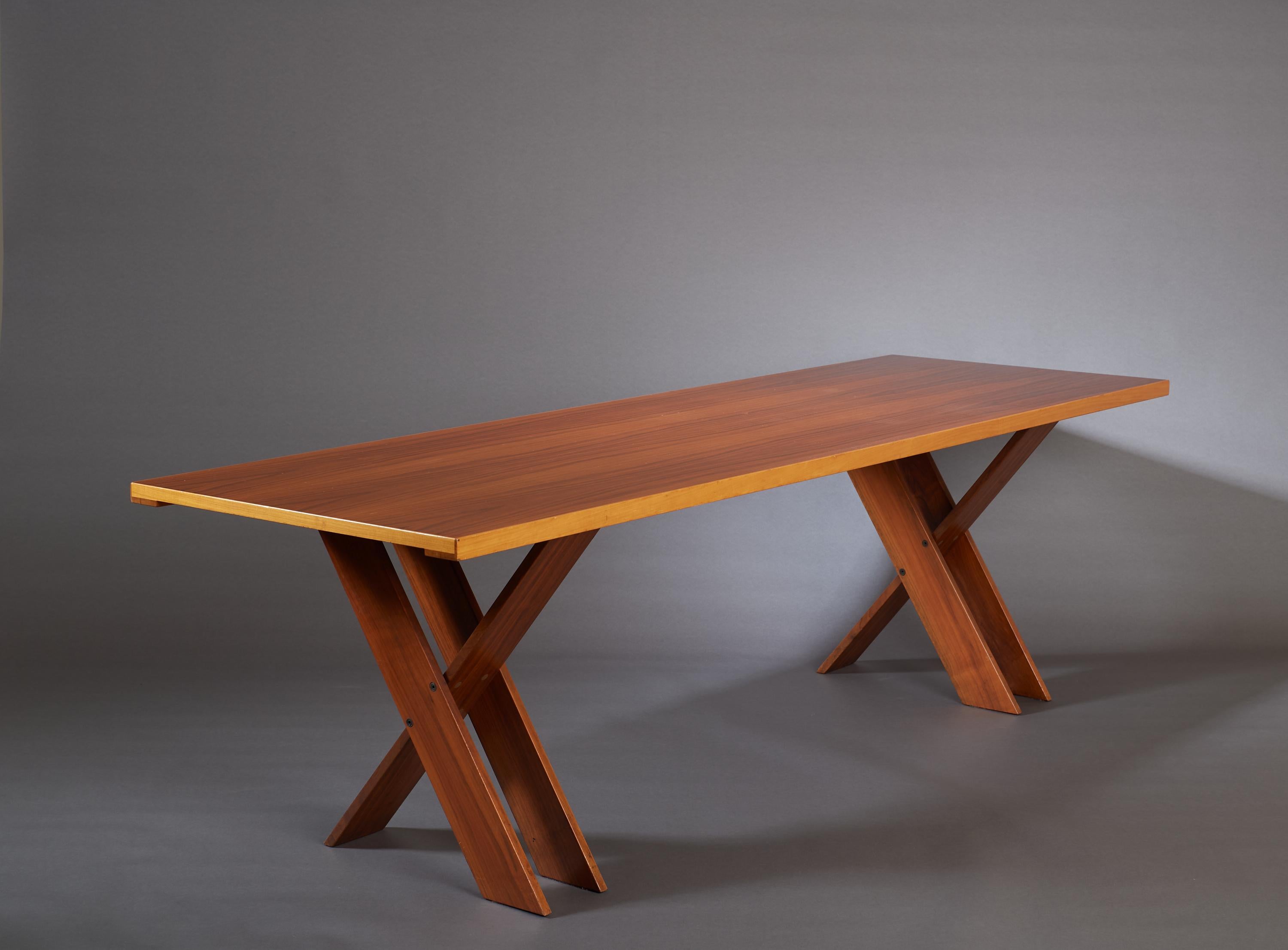Marco Zanuso (1916-2001)

A large and striking modernist dining table by Marco Zanuso, in polished walnut. With architectural double X-legs and a beautiful two-tone top, the pure, strong lines of the design are complimented by the  tactile grain of