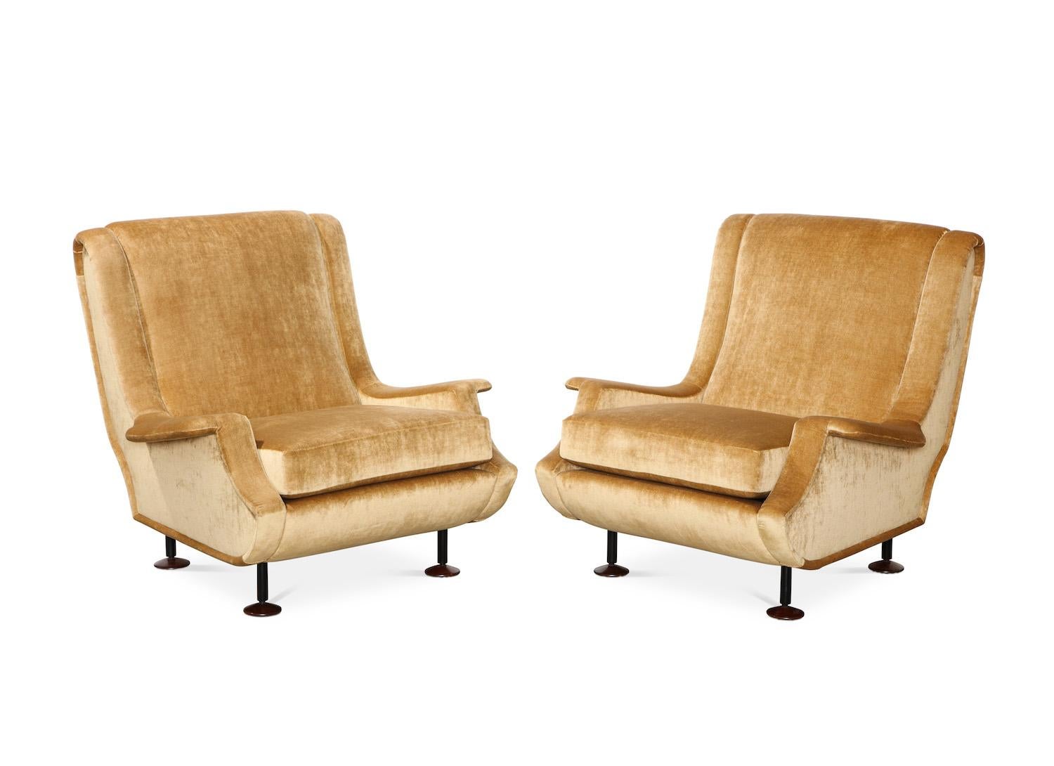 Marco Zanuso rare pair of “Regent” lounge chairs. Elegant, sculptural lounge chair of unusual form. Black metal legs, wood feet and pale-gold velvet upholstery.