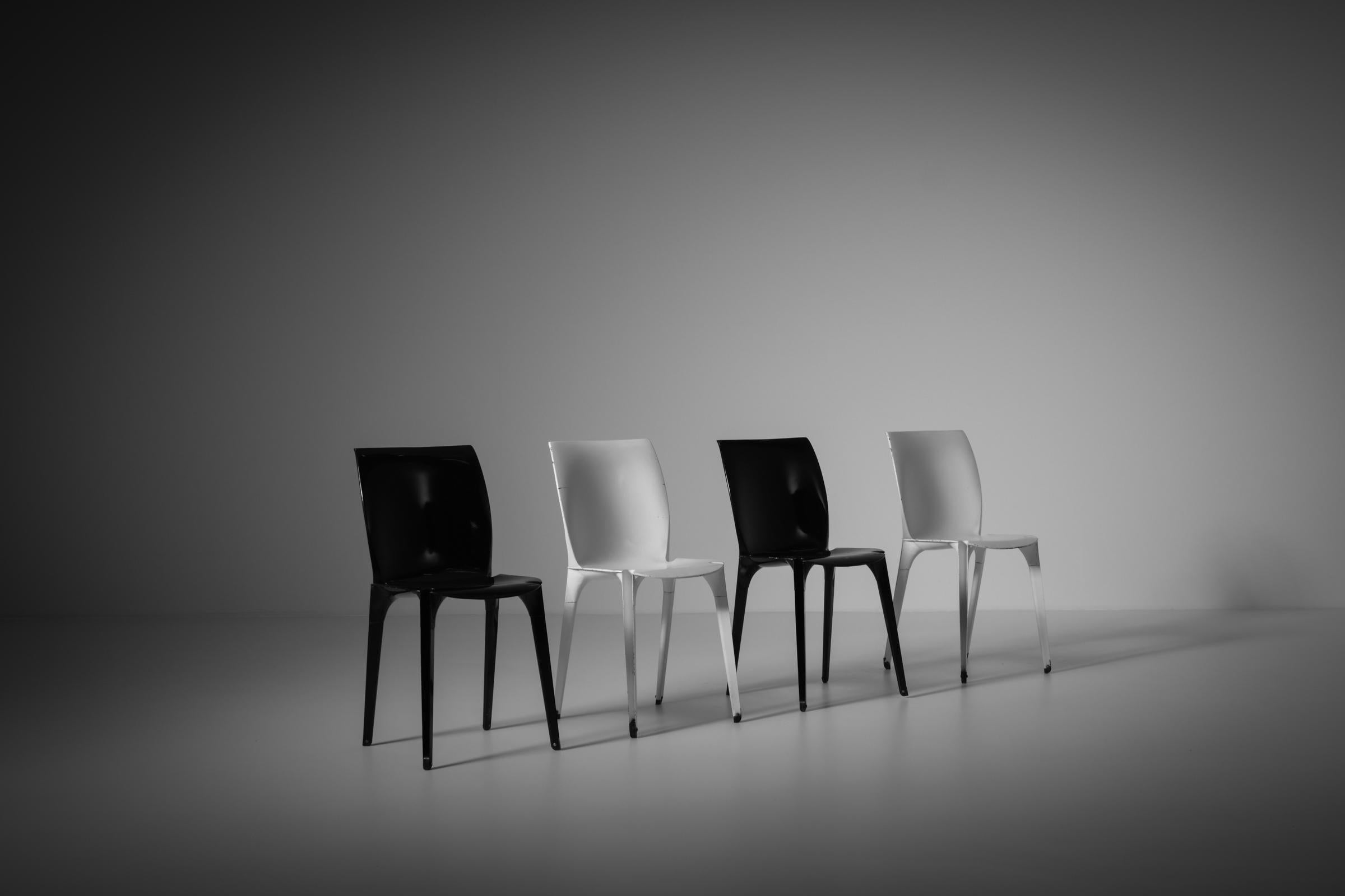 Set of four Lambda chairs by Richard Sapper and Marco Zanuso for Gavina, Italy 1959. Industrial and revolutionary design made from stamped and enameled metal and rubber feet. The technique to stamp and shape the metal comes from the car industry