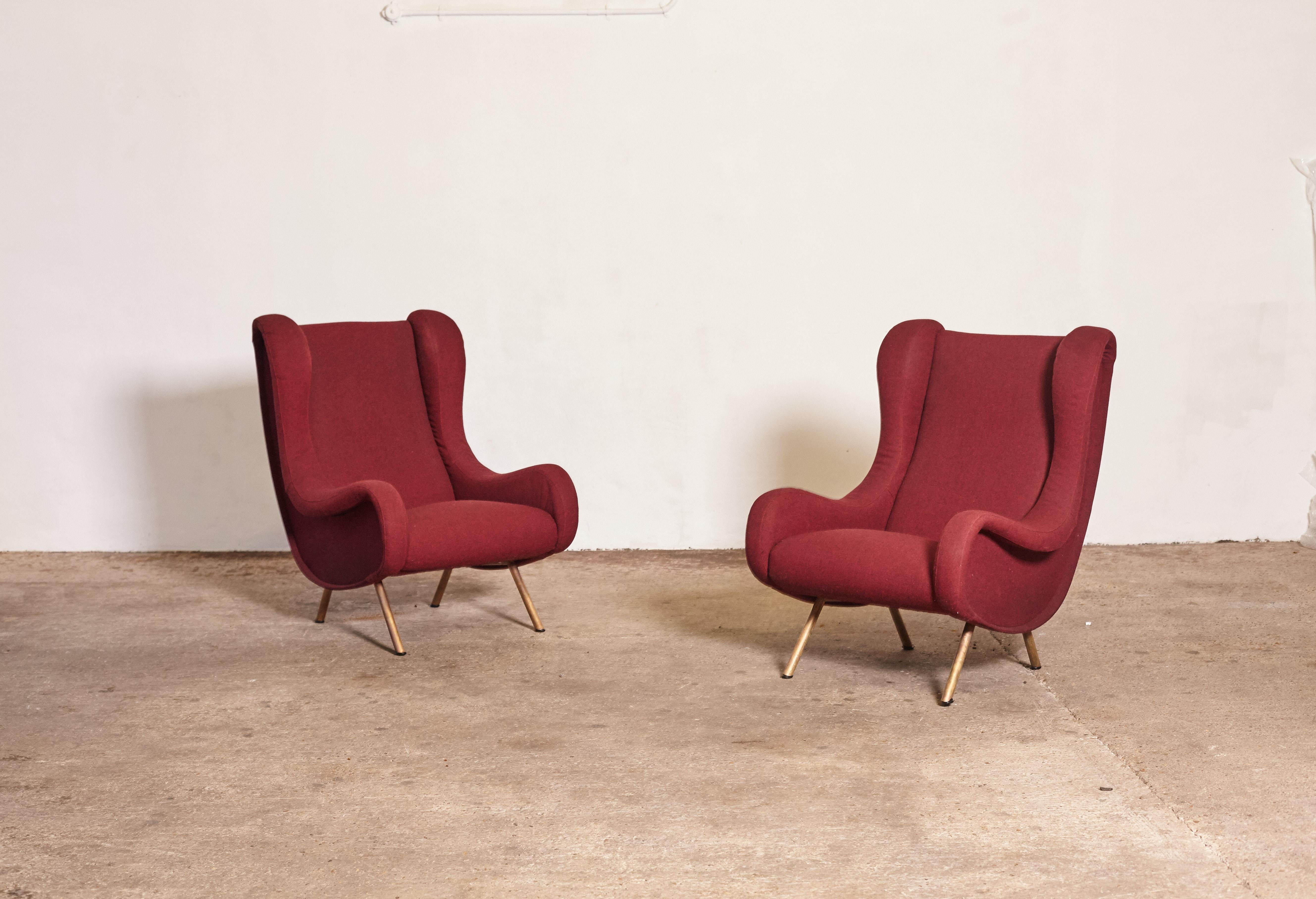 An pair of authentic Marco Zanuso Senior chairs, Arflex, Italy, 1960s. These chairs have been reupholstered in a burgundy wool fabric within the last 5 years. If you would like another fabric we can assist with re-upholstery.




UK customers please