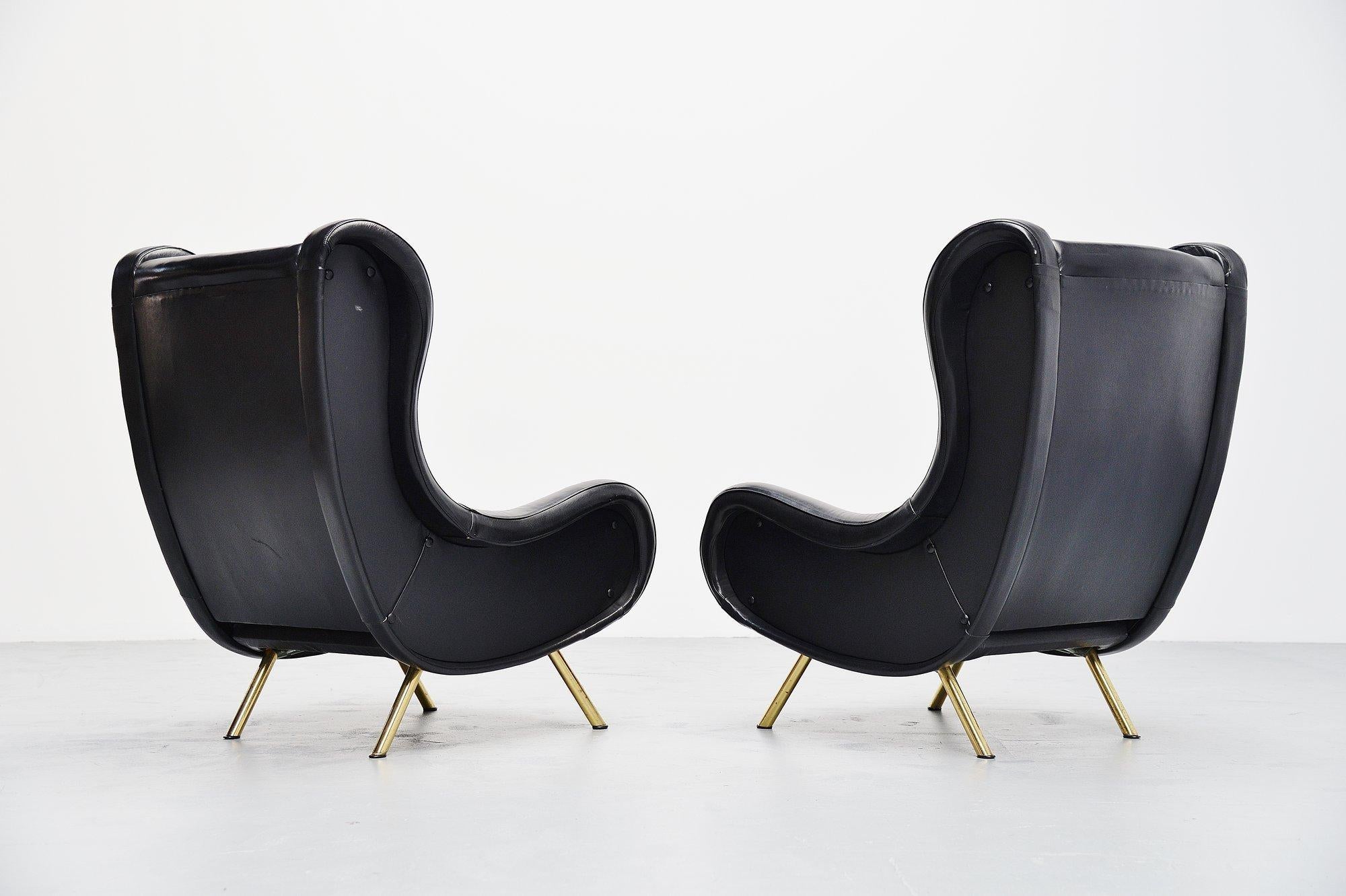 Fantastic iconic lounge chair pair designed by world known designer Marco Zanuso and manufactured by Arflex, Italy 1951. These two lounge chairs have their original leather upholstery which is quite rare for these chairs. The condition of the