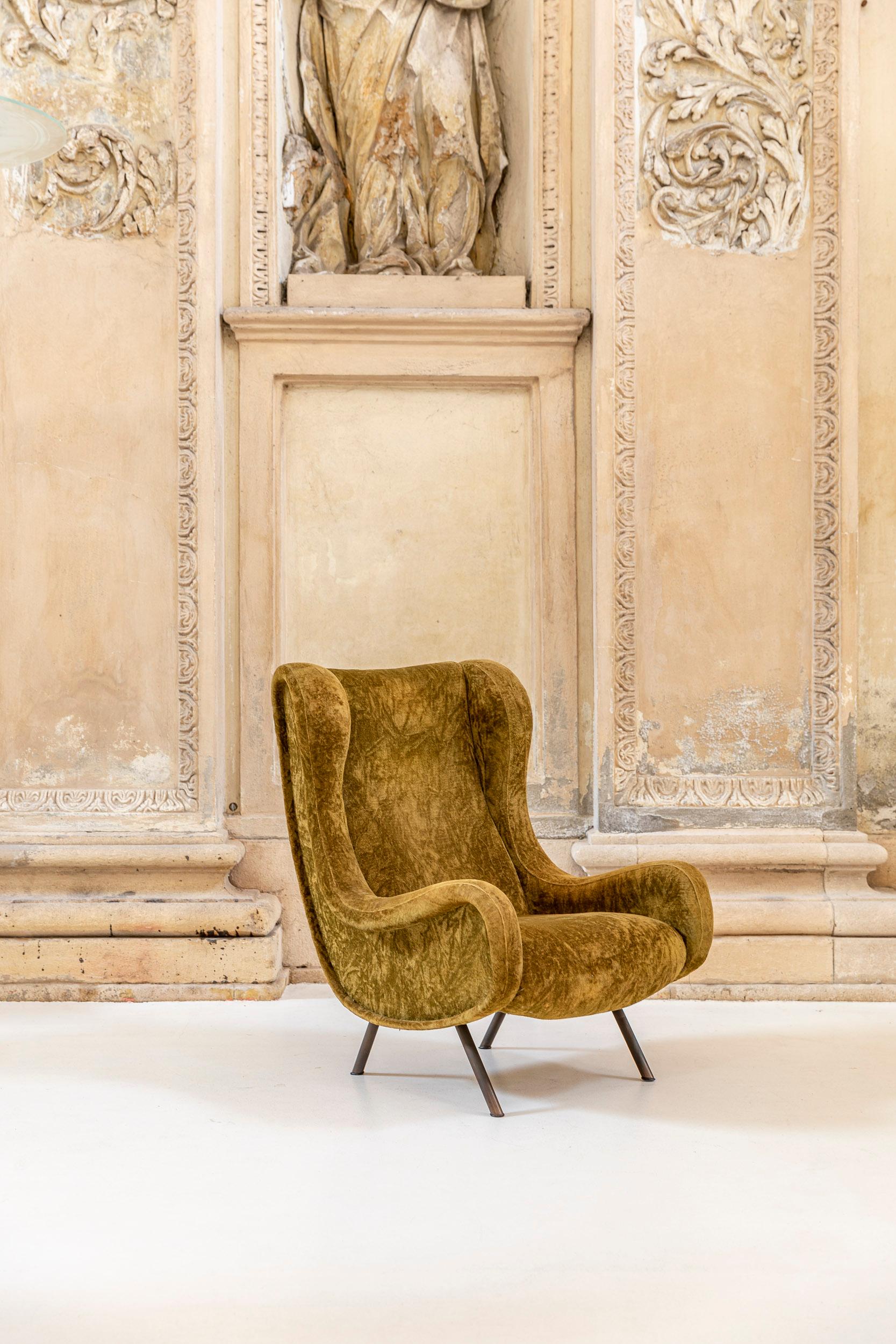 A stunning authentic Marco Zanuso senior chair for Arflex. 
The item present the authentic green olive velvet fabric, beautiful and characteristic brass details like the four legs. 
Italy 1950 ca.