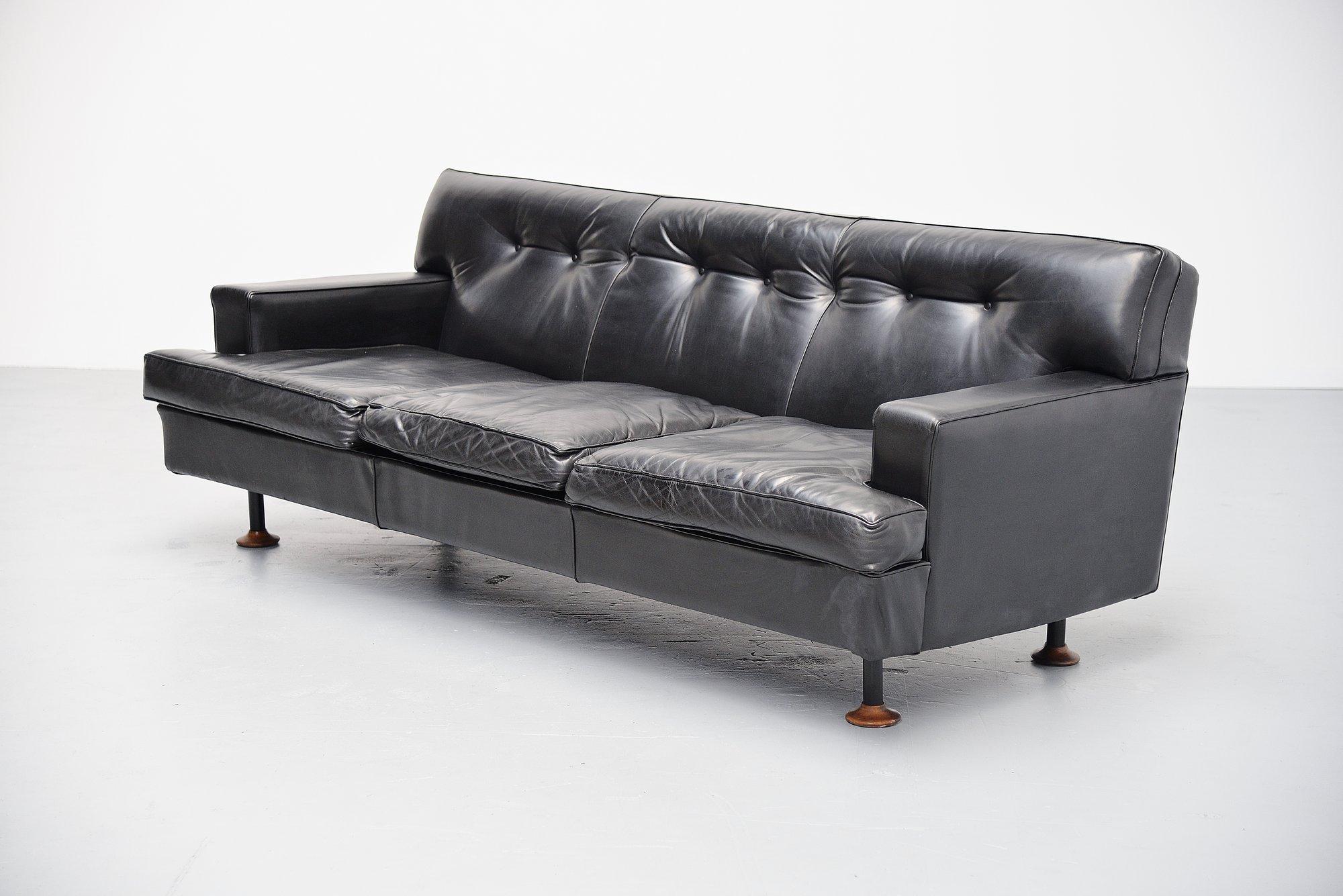 Rare 'square' sofa designed by Marco Zanuso and manufactured by Arflex, Italy 1962. This sofa is upholstered in high quality black leather which is the original upholstery. The legs are made of black painted metal and the feet are in solid teak.