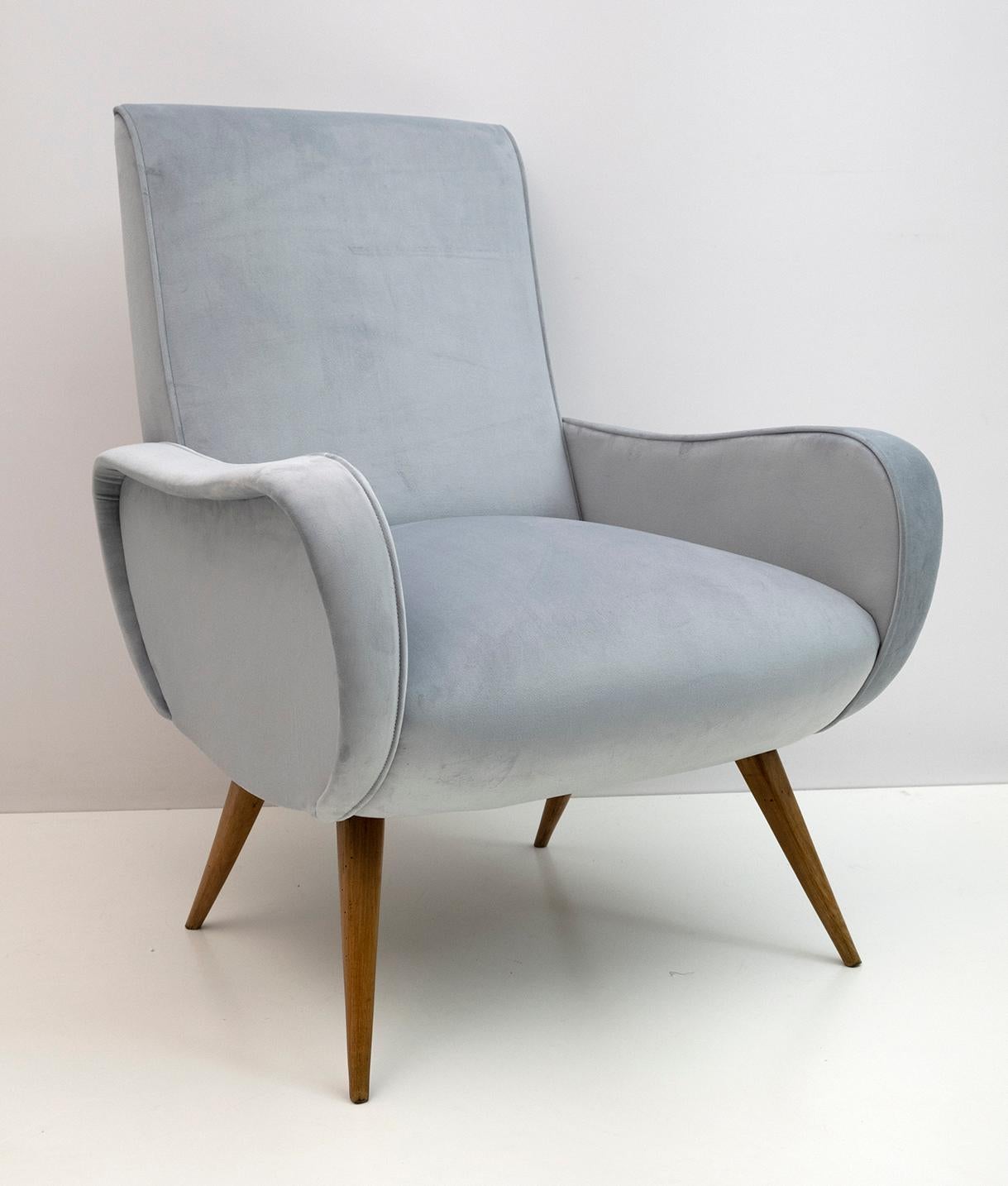 Marco Zanuso style armchair. The armchair has been restored and reupholstered in blue velvet, the feet are in beech wood.