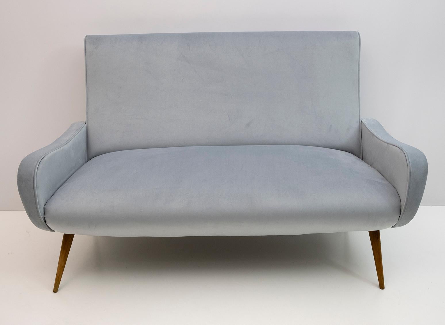 Lady Marco Zanuso style sofa. The sofa has been restored and upholstered in blue velvet, the feet are in beech wood.

The two armchairs are also available

Immediately after the war, Marco Zanuso began a fruitful collaboration with Arflex which