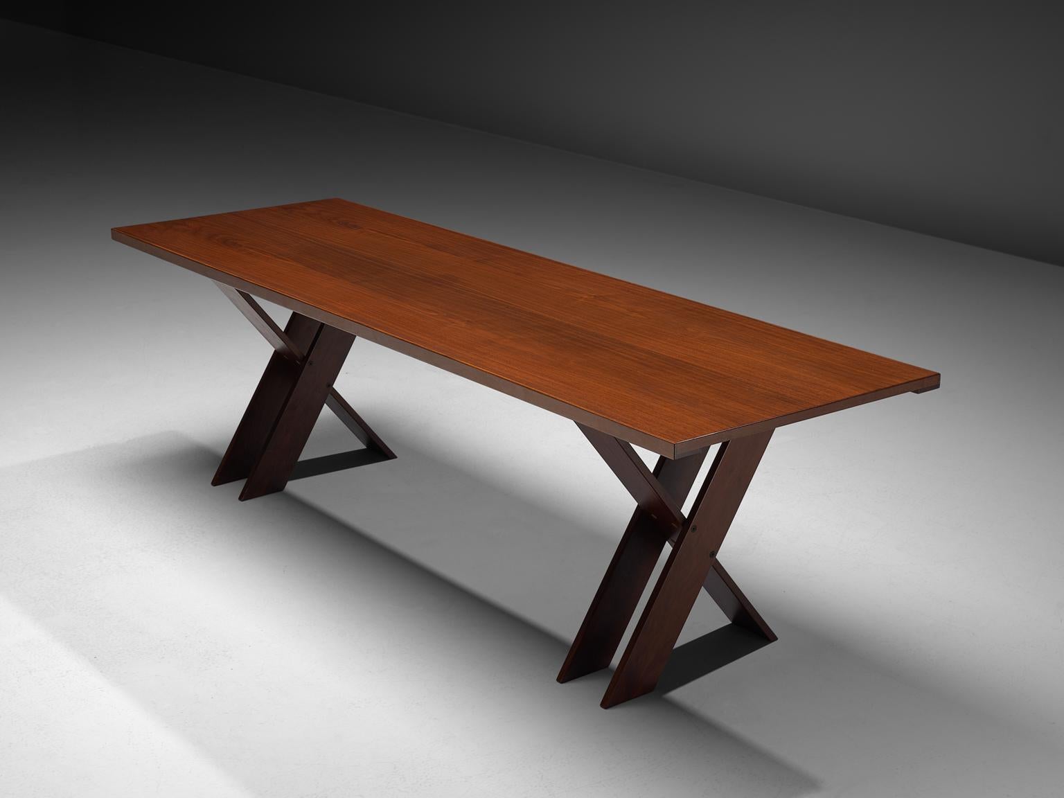 Marco Zanuso for Poggi, TL58 dining table, walnut, 1974.

This dining table is manufactured by Poggi in the 1974. It features crossed, double legs that give the table an architectural appearance. The table is made of high quality walnut wood, which