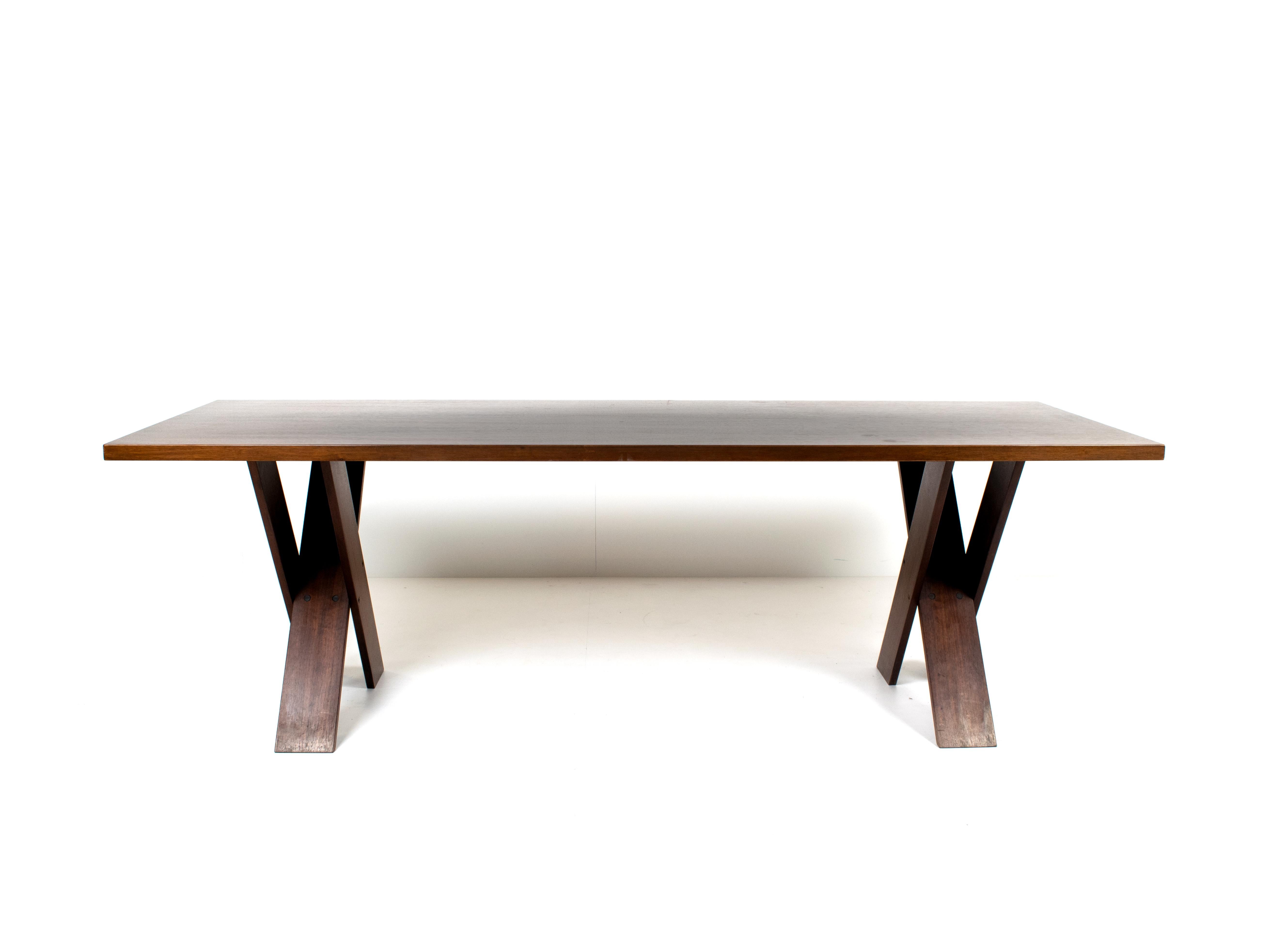 Rare Marco Zanuso walnut dining table TL 58 for Poggi, Italy 1970s. This table has double X-legs, combining architecture and minimalism. The dark polished walnut gives it a warm and more traditional feel. Marco Zanuso was a designer and an