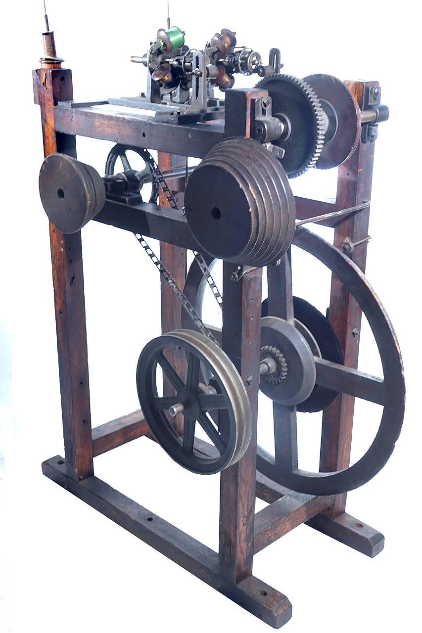 It took me years to figure out what this machine did for a living. It would take thin steel or copper wire and wrap it with silk. The machine is mid-late 19th century. The silk wrapped wire was then used to create electro-magnets for telegraph