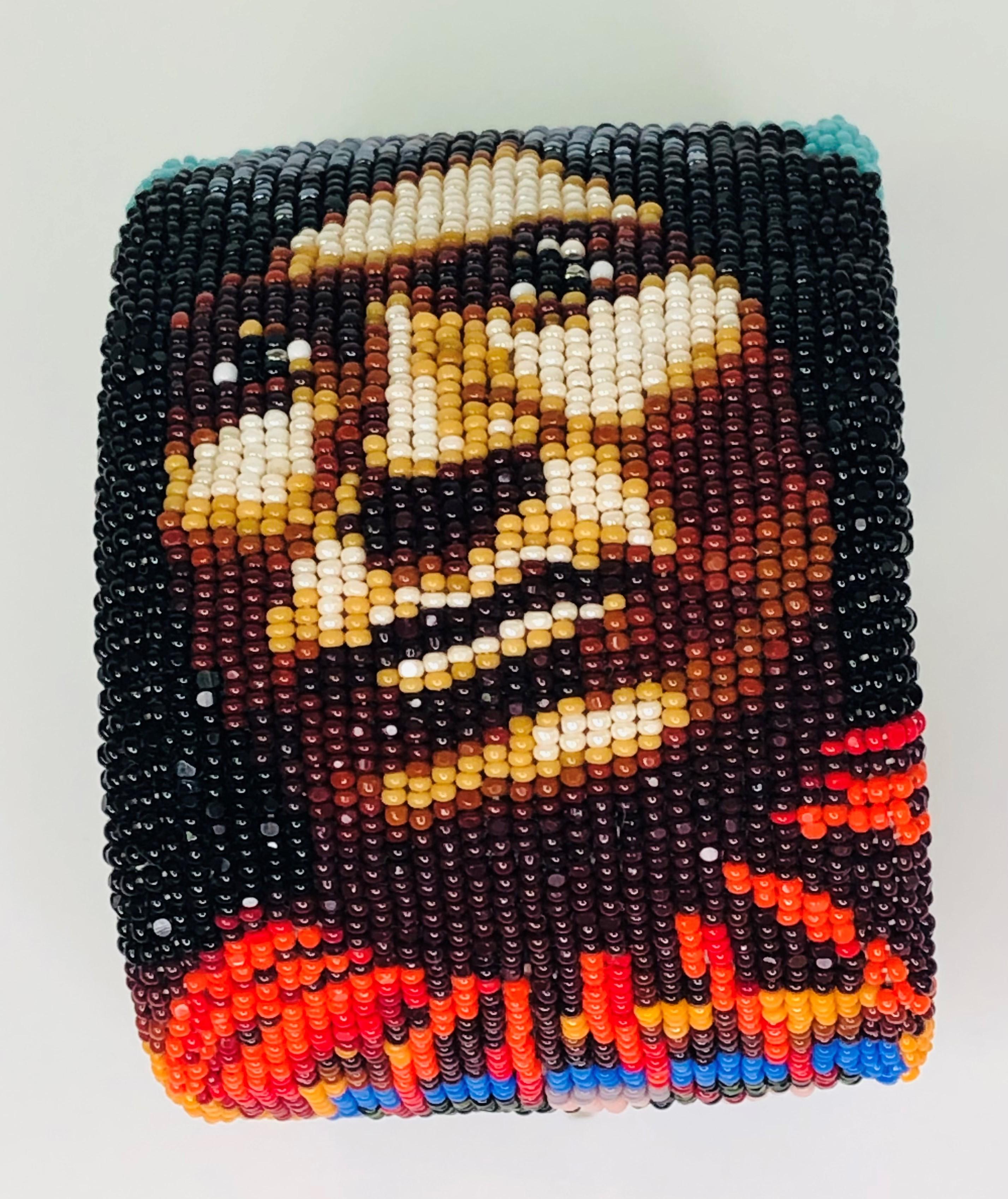 By famous Native American artist, Marcus Amerman, this bracelet is one-of-a-kind!  
The attention to detail and craftsmanship are unmatched.  
Glass beaded bracelet is a portrait of Scorched Lightning, (Assiiboine) Sioux Nation shows his face and