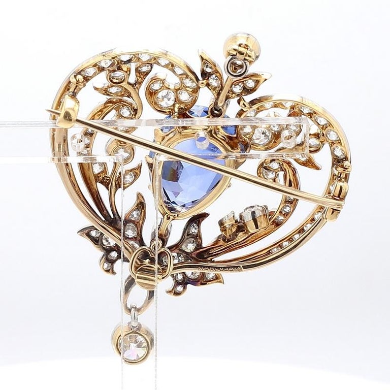 A Sapphire And Diamond Pendant/brooch, By Chaumet Of Flowerhead Design, The  Circular-cut Sapphire Auction
