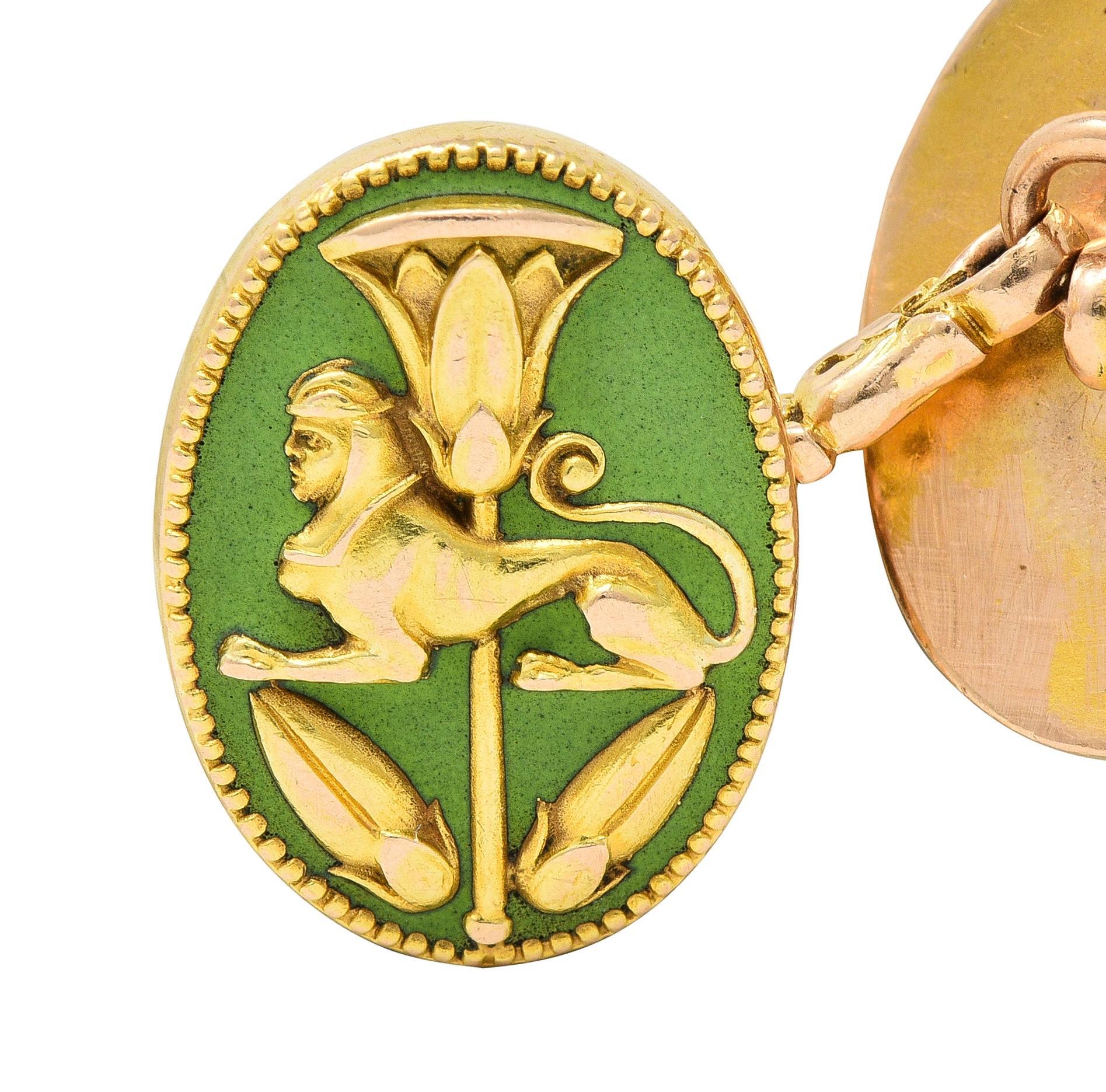 Designed as link-style cufflinks terminating with oval-shaped faces
With stylized gold lotus flower, pharaoh, Eye of Horus, and a sphinx
Each raised with grooved detailing - atop enamel surrounds
Opaque and glossy light yellowish green - minimal