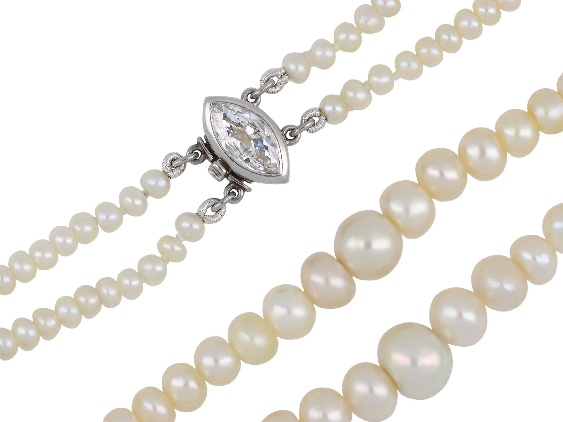 Marcus & Co. natural saltwater pearl necklace. Composed of three hundred and forty-eight natural saltwater pearls, further set with a marquise shape old cut diamond in an open back rubover with an approximate weight of 0.60 carats, to an elegant