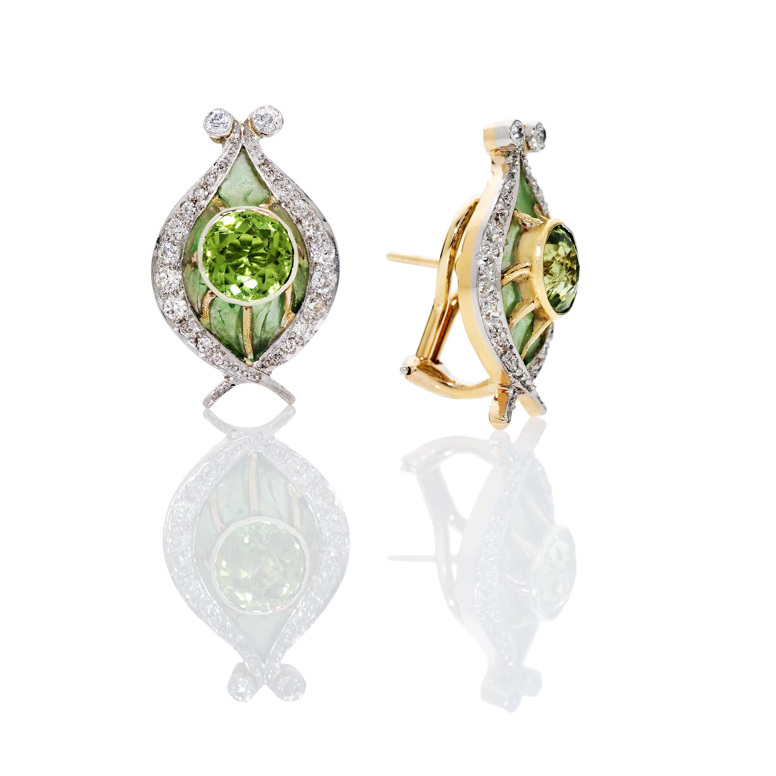 Art Nouveau Plique a Jour Earrings created between 1900 - 1910.  The earrings were made with a matching broach that was converted into a triple strand necklace listed separately.  These magnificent pieces of history have been fully restored and are