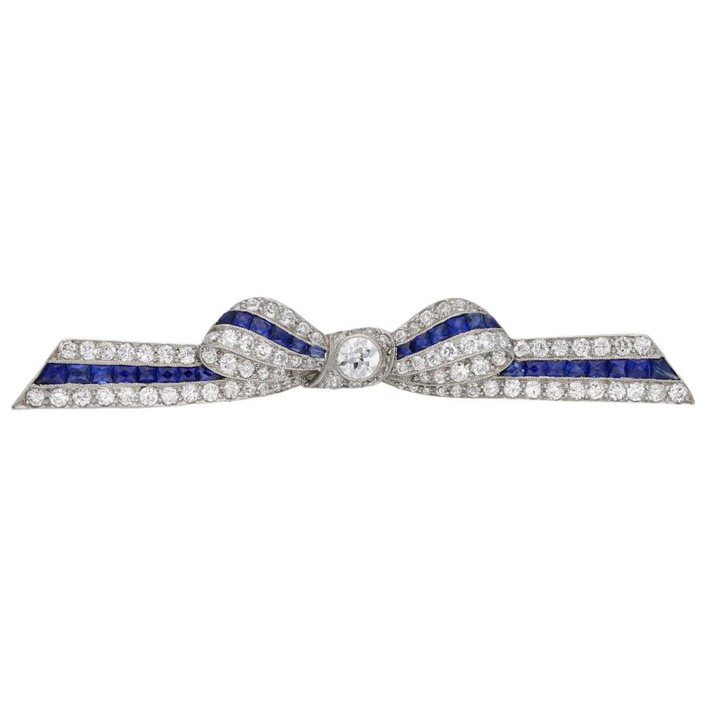 Marcus & Co. Sapphire and Diamond Bow Brooch, American, circa 1935 For Sale