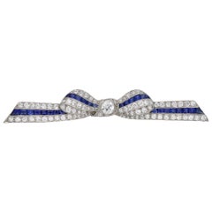 Antique Marcus & Co. Sapphire and Diamond Bow Brooch, American, circa 1935