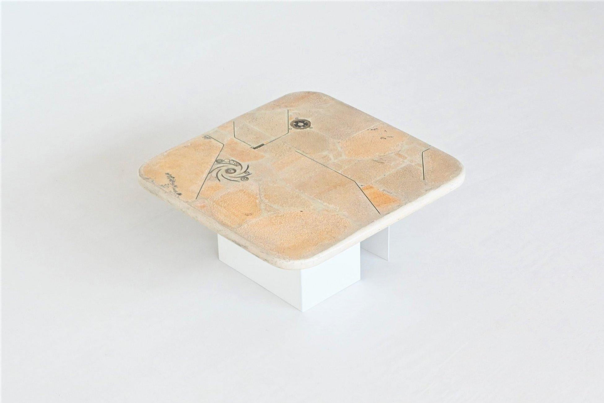 Beautiful square shaped coffee table designed and made by Marcus Kingma, The Netherlands 1992. The heavy white concrete top rests on a base of two off white lacquered metal bases that can be placed in several positions. Beautiful composition of