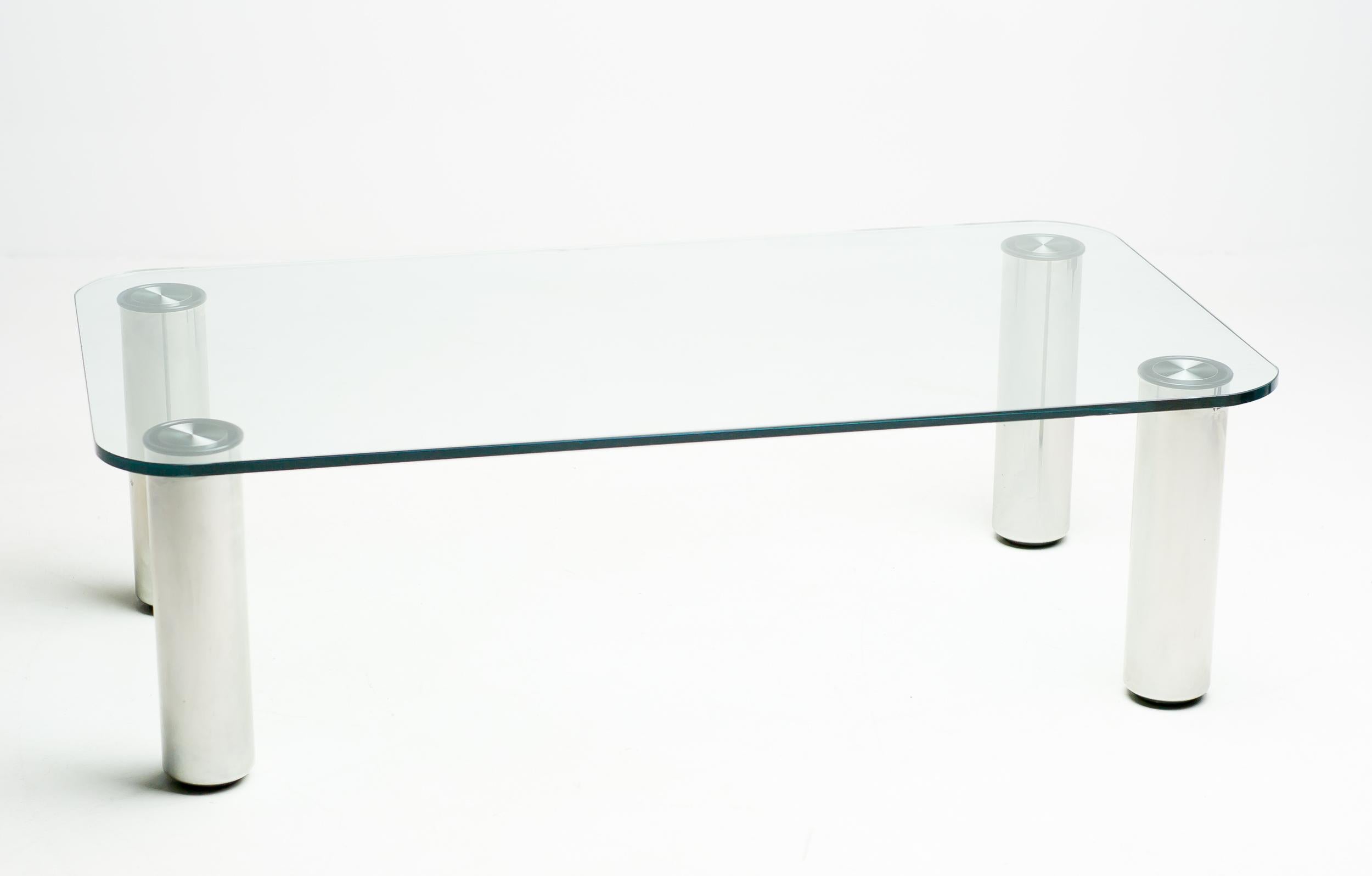 Glass coffee table designed by Marco Zanuso with glass top and detachable stainless steel legs.