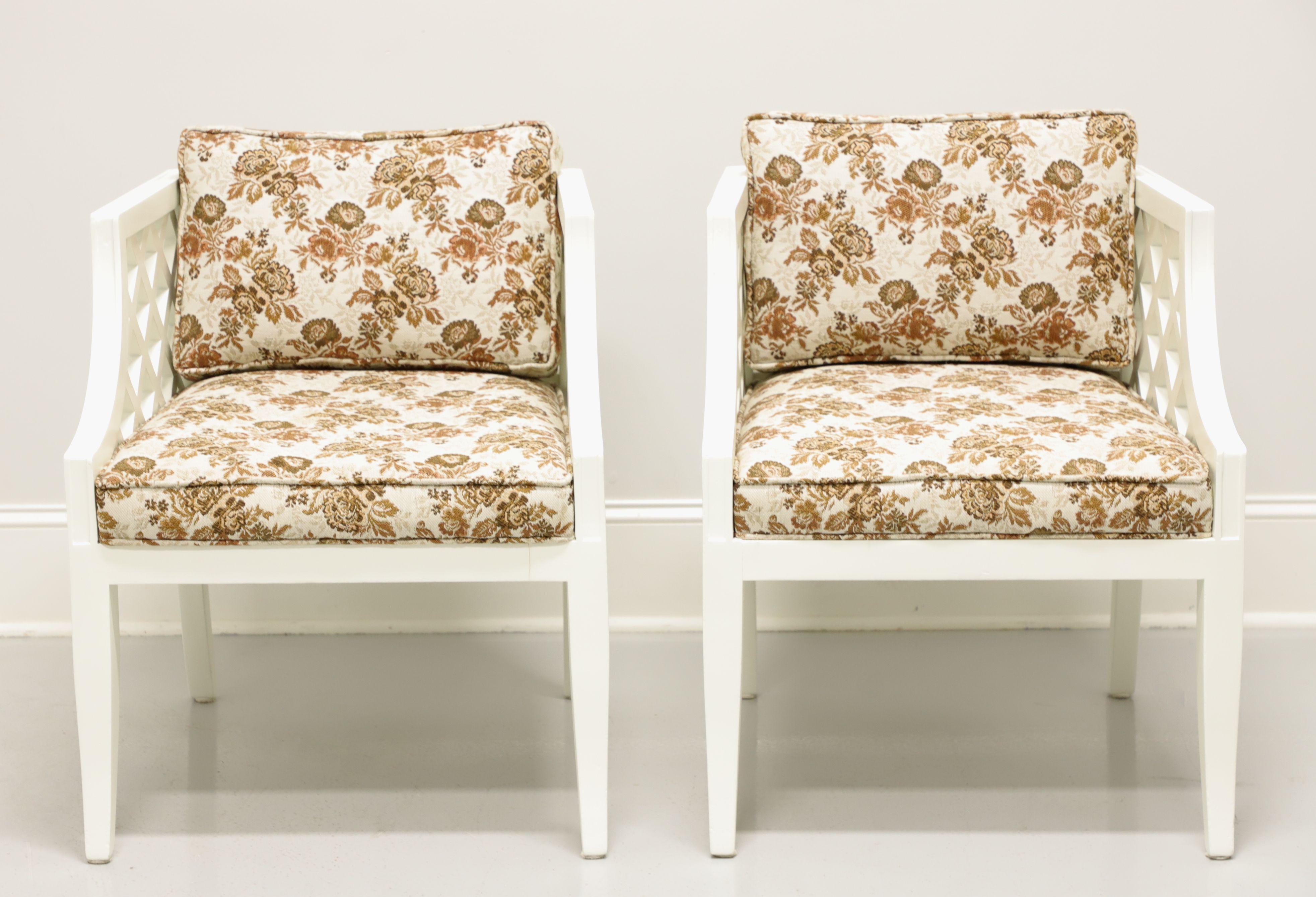 A pair of Mid Century occasional chairs by Marden Manufacturing, of Chicago, Illinois, USA. Solid wood freshly updated with an ivory color paint. Features lattice like sides, ladder backs, an upholstered seat and a back cushion in a brown & white