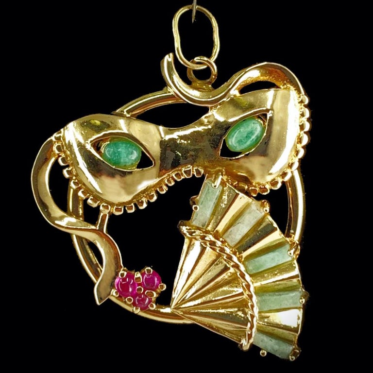 Cabochon Mardi Gras or Carnaval Mask & Fan Pendant with Rubies in Yellow Gold, Circa 1960 For Sale