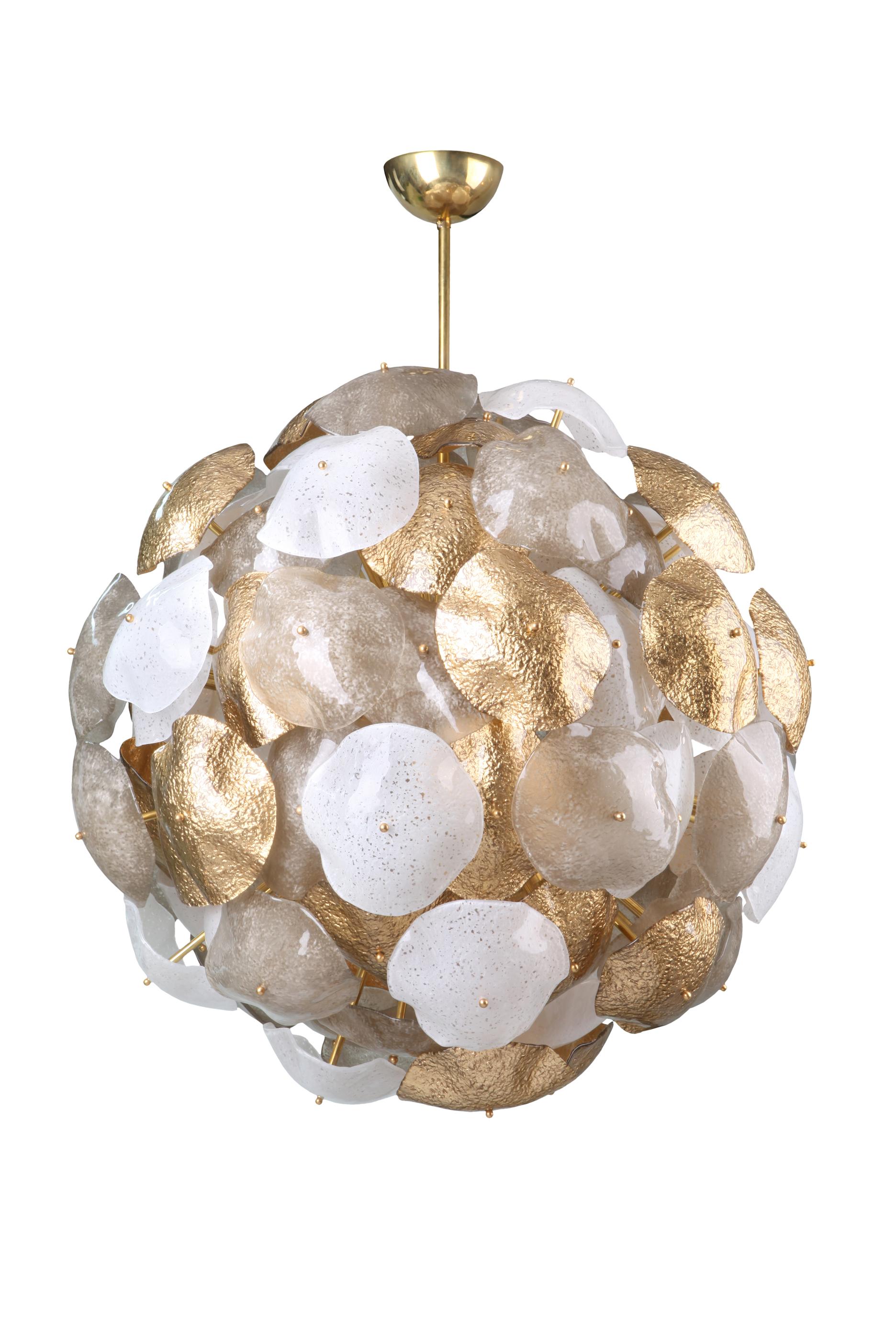 Handcrafted Murano glass freeform discs, 24-carat gold leaf, brass frame and details.

This Sputnik chandelier is made to order with a natural brass orb, natural brass rods at two lengths, a brass drop rod and brass canopy. The glass discs are