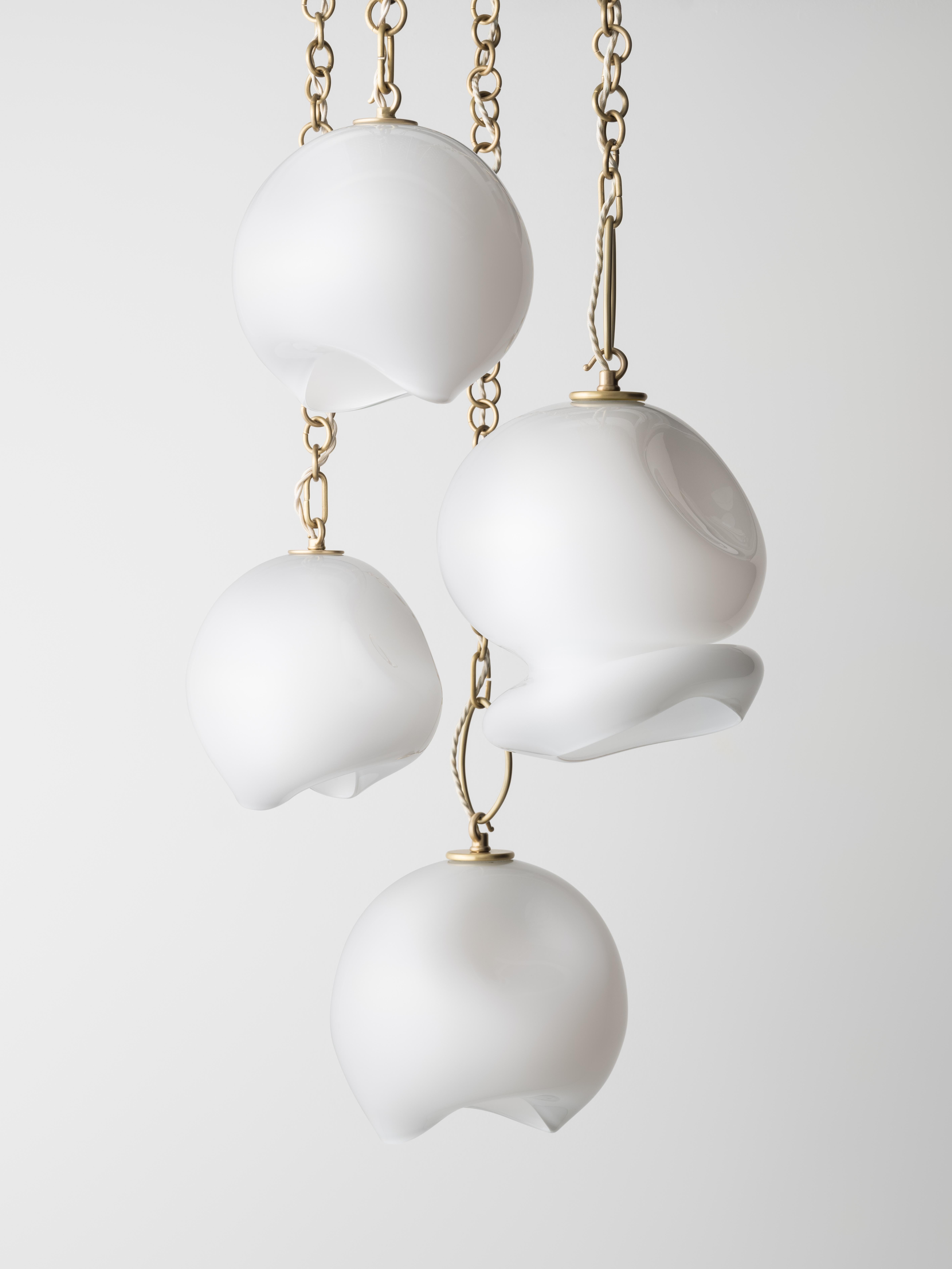 American Marea Seven-Pendant Chandelier: Satin Brass/White Glass by Avram Rusu Studio For Sale