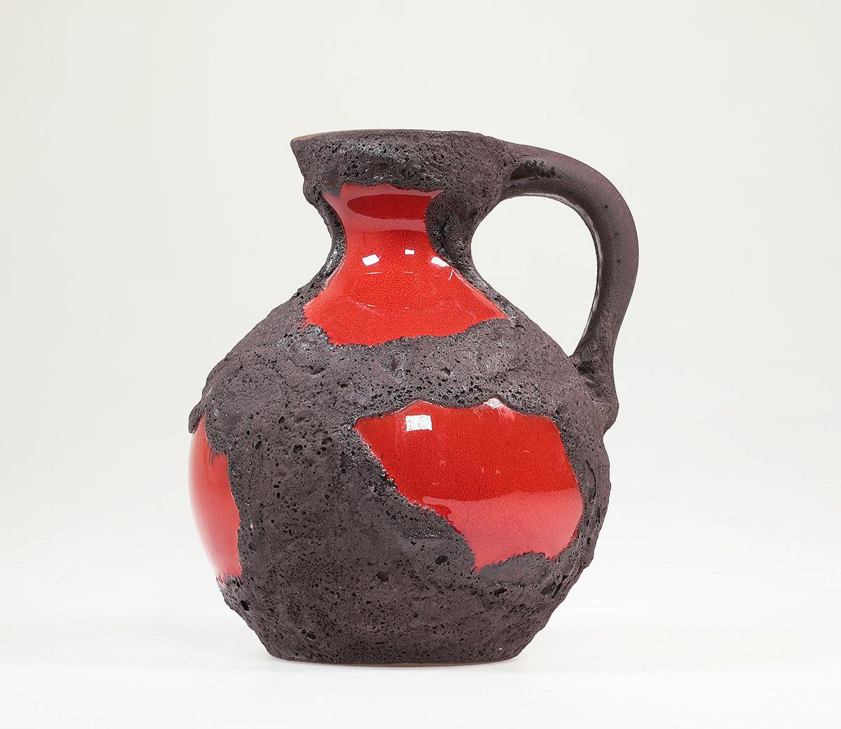 Vintage ceramic Fat lava vase produced by Marei Keramik, West Germany. 1970s.

Beautiful jug vase in a fire brigade red gloss glaze with thick dark brown rough decor.

High 19 cm.

numbered 4301

In good condition.

