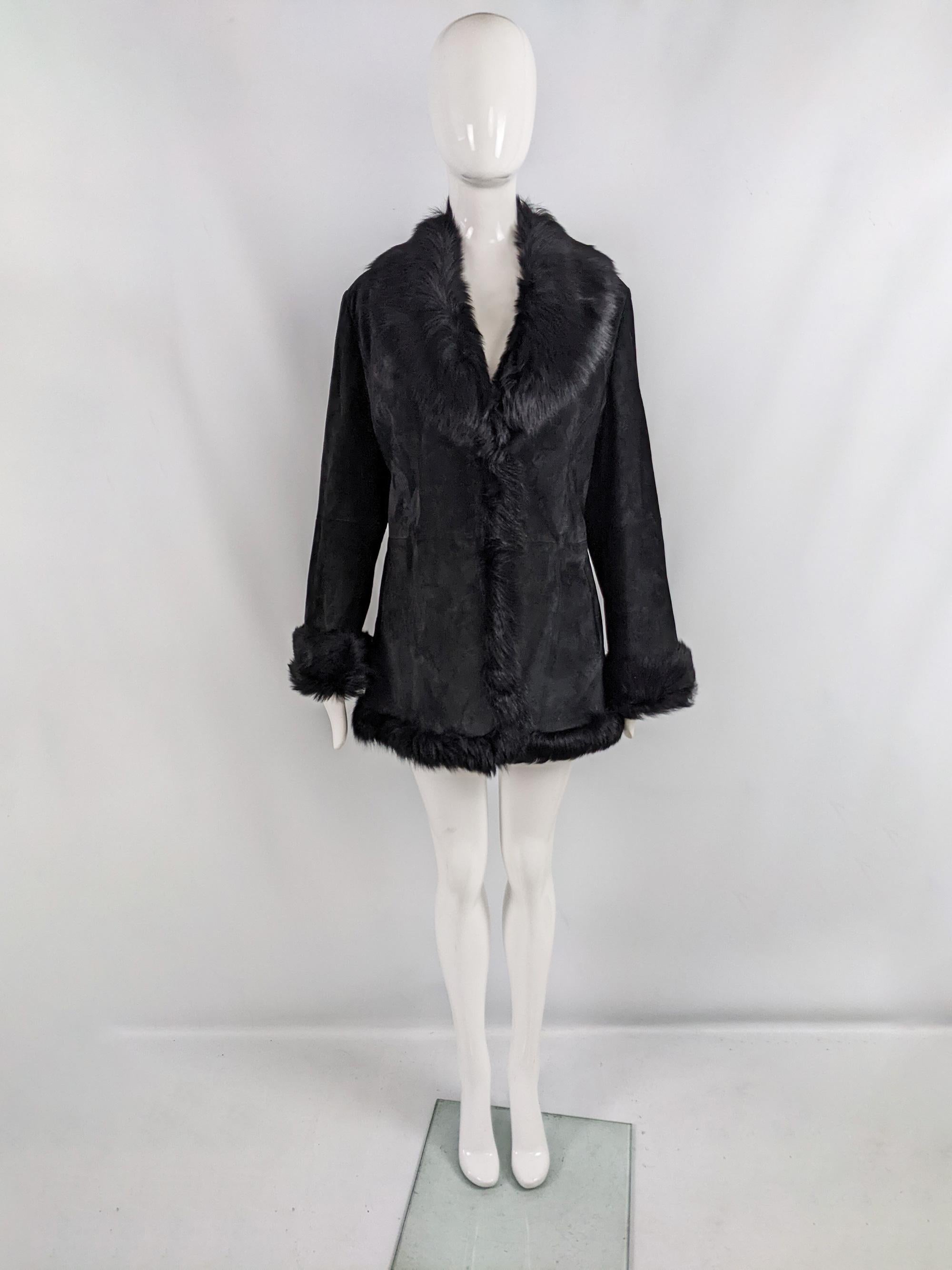 A glamorous vintage womens coat from the 90s by luxury Italian fashion house, for their Marella Sport line. In a black calf suede fabric with a real lamb shearling trim on the collar, hem and cuffs.

Size: Marked GB 14/ EU 44 / US 10. Please check