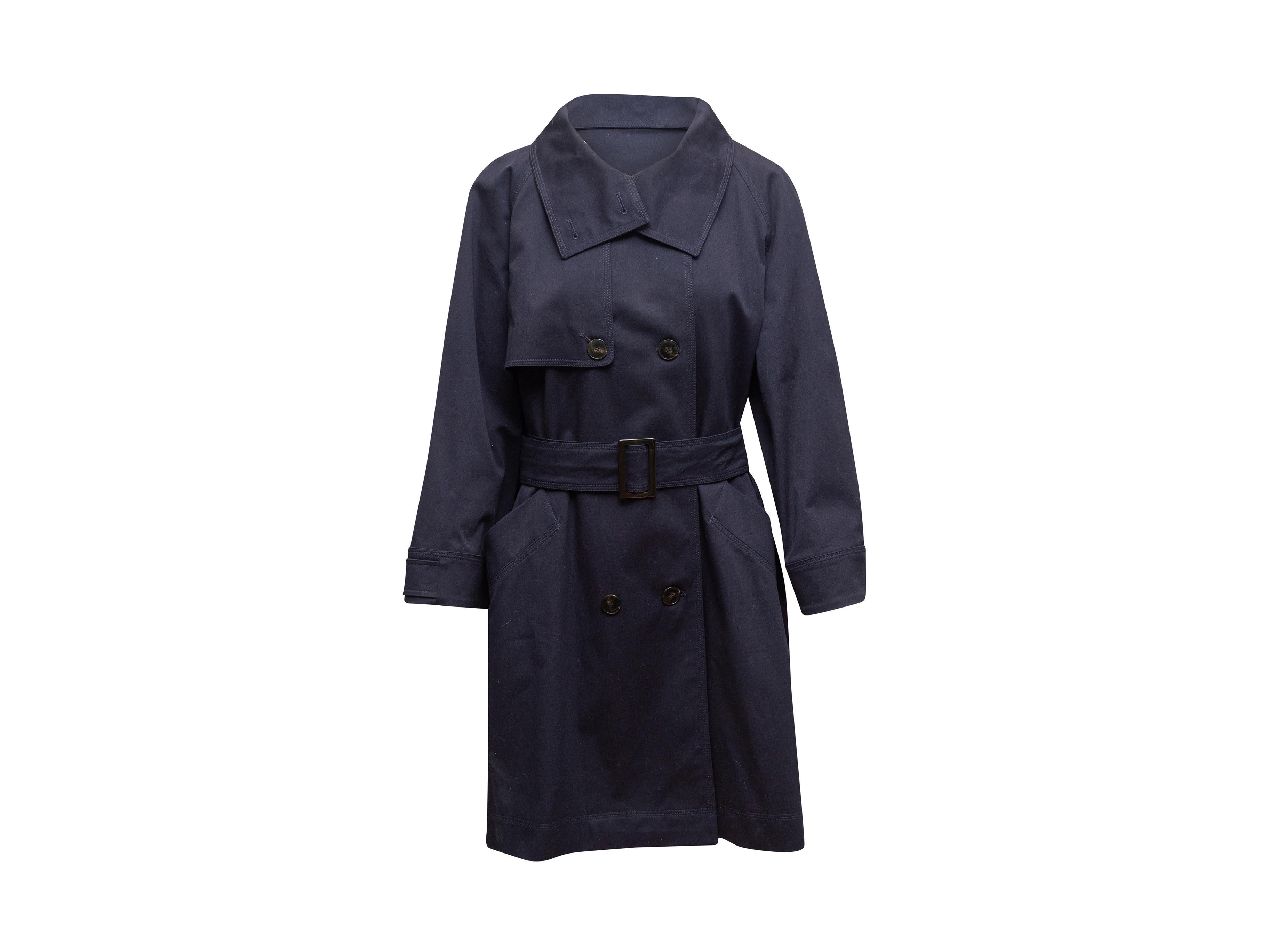 Product details: Navy cotton double-breasted trench coat by Marella. Dual hip pockets. Button closures at front. 46